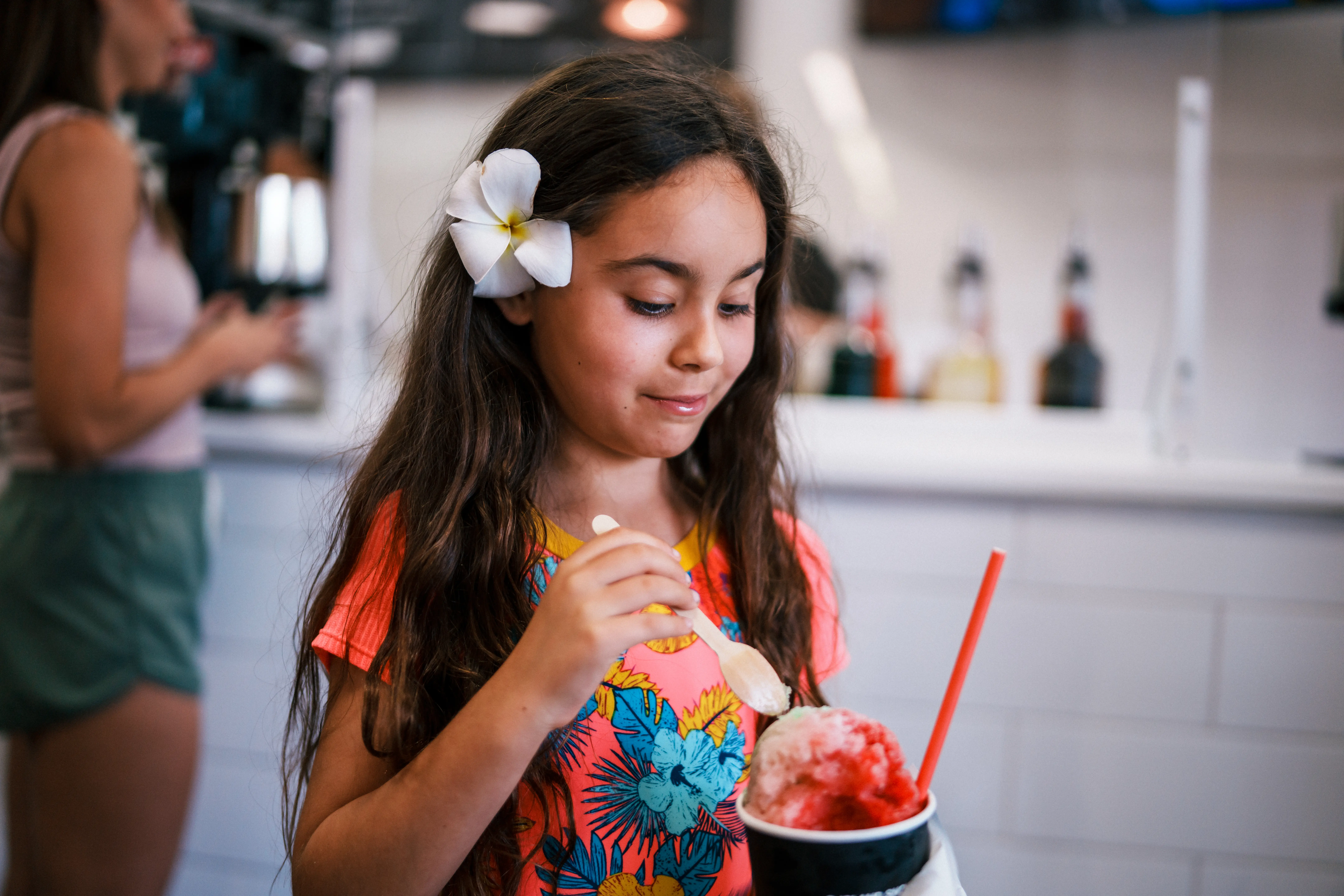 Picture of young girl eating Hawaiian shaved ice