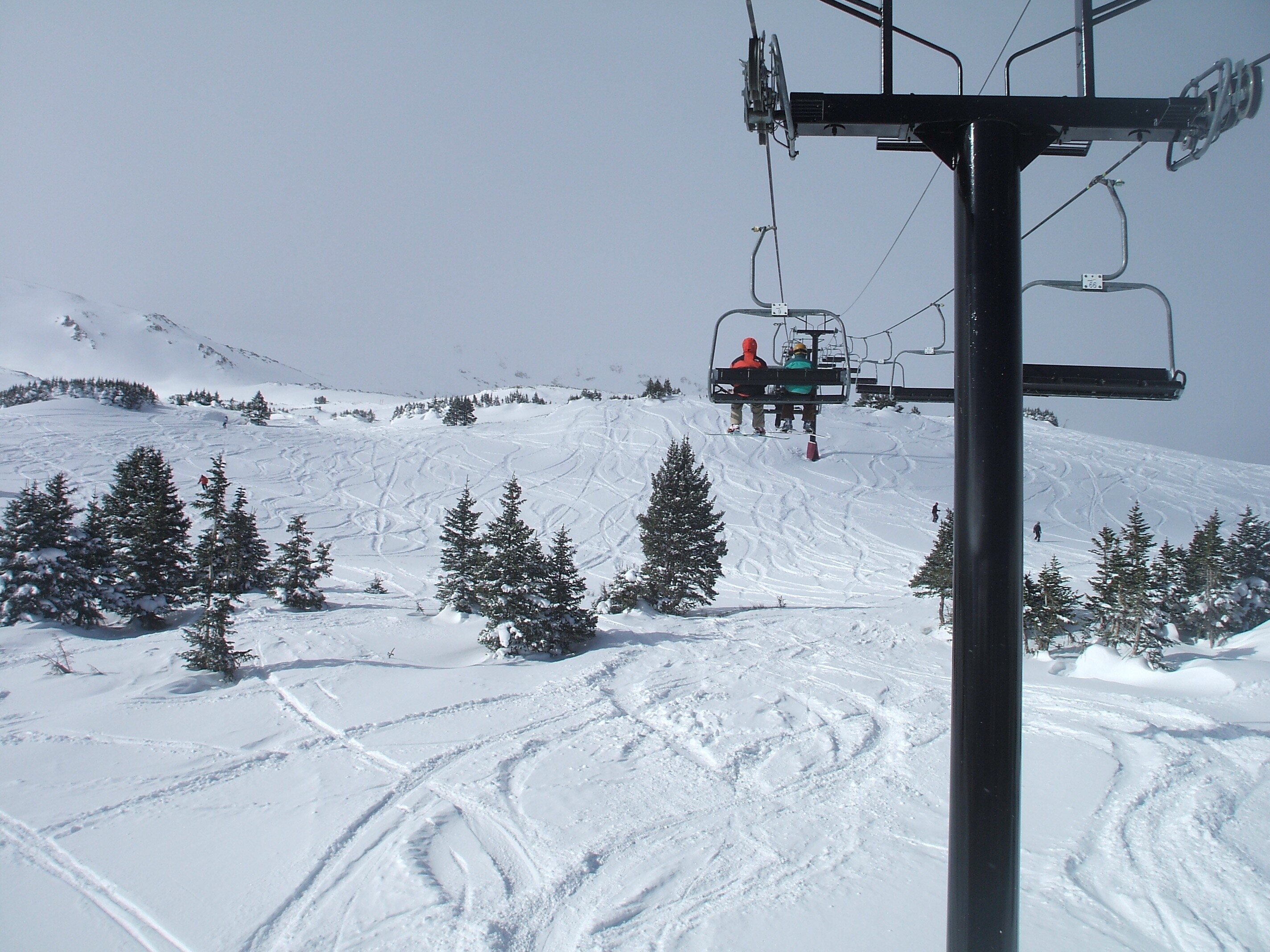 Image of skiers on board the ski lift at Loveland Ski Area in Colorado.