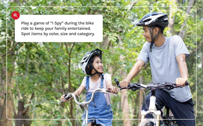 A father and daughter enjoying a bike ride in the park. 