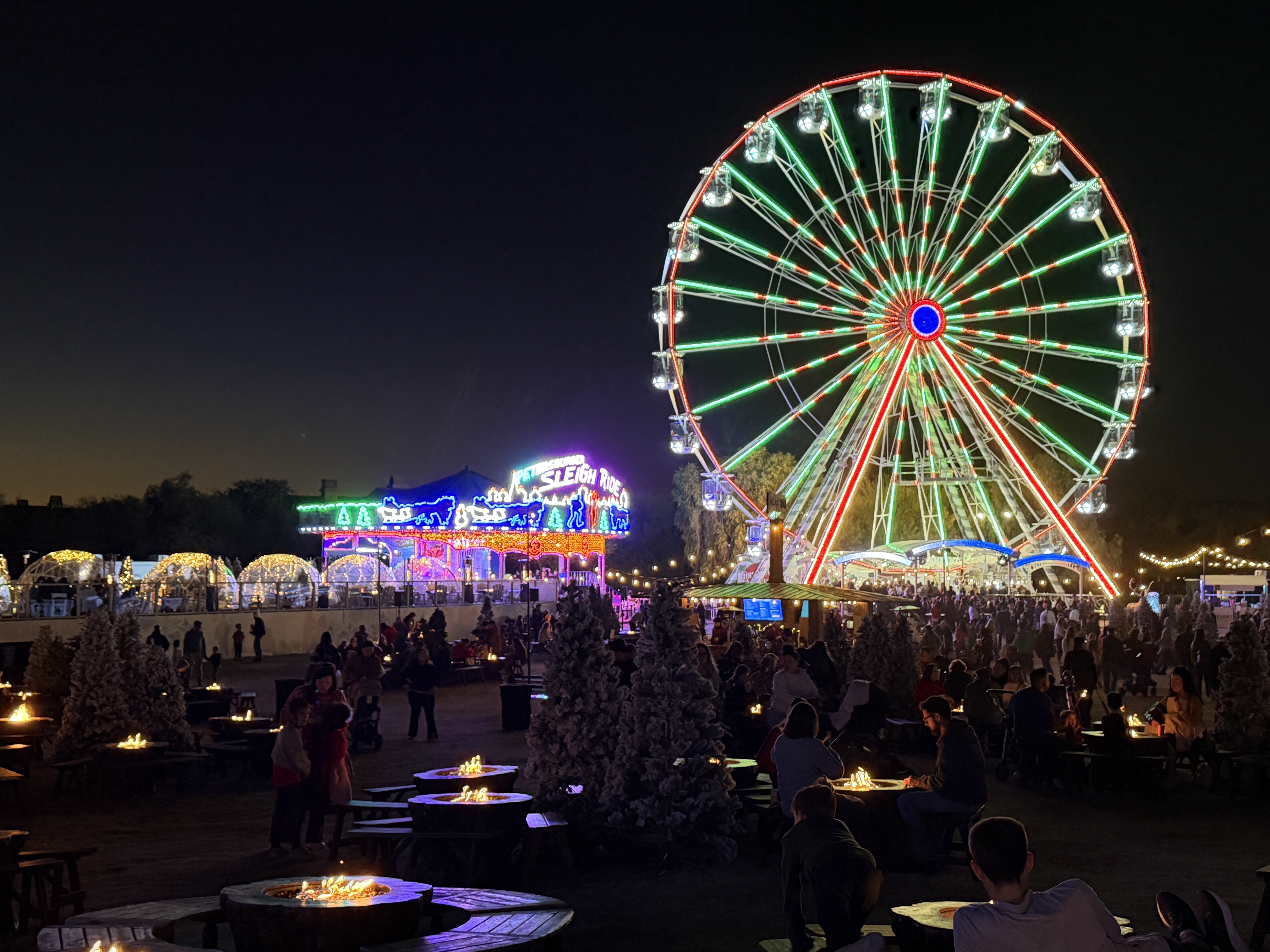Ferris Wheel at night lit in red and green