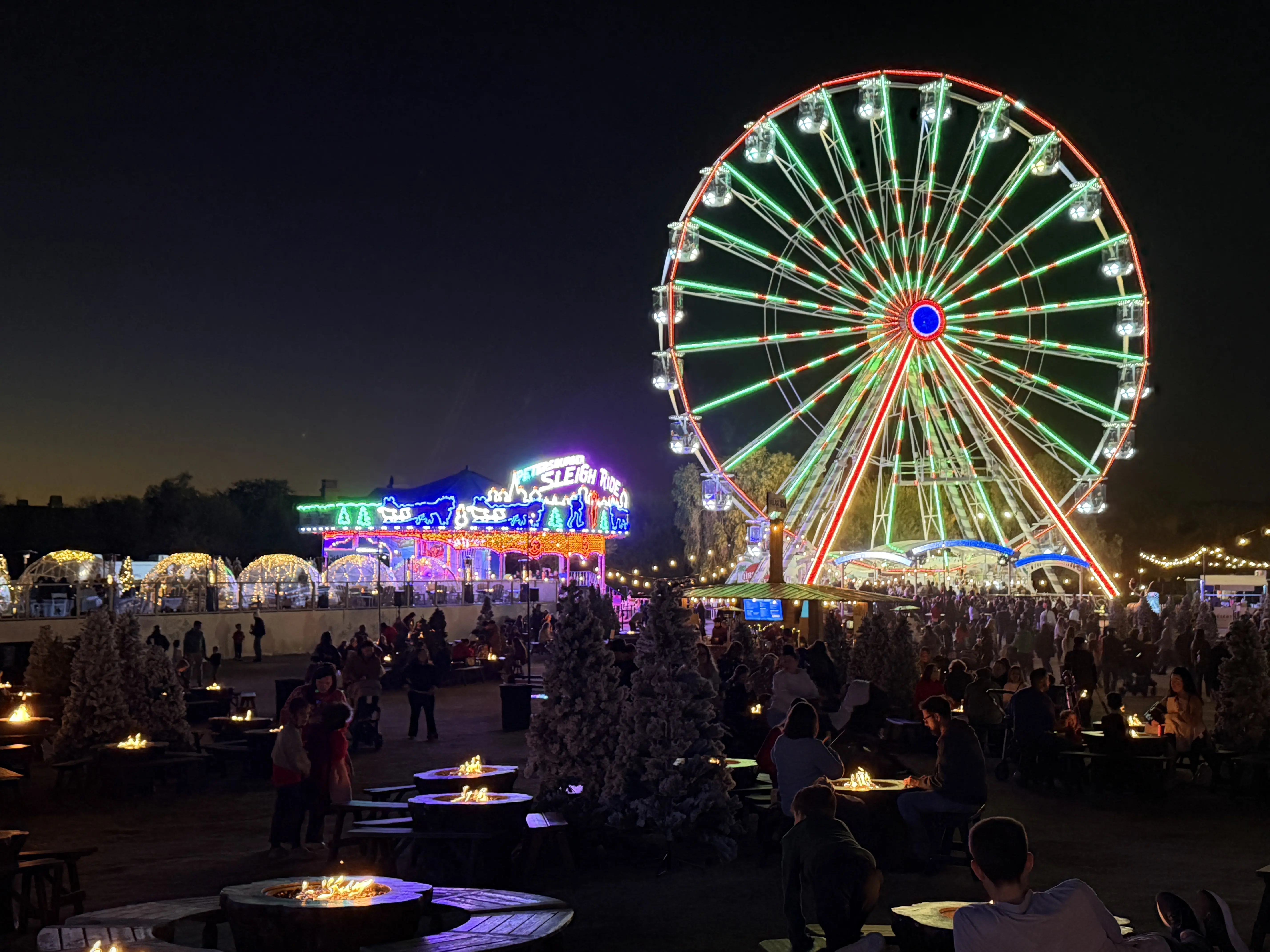 Ferris Wheel at night lit in red and green