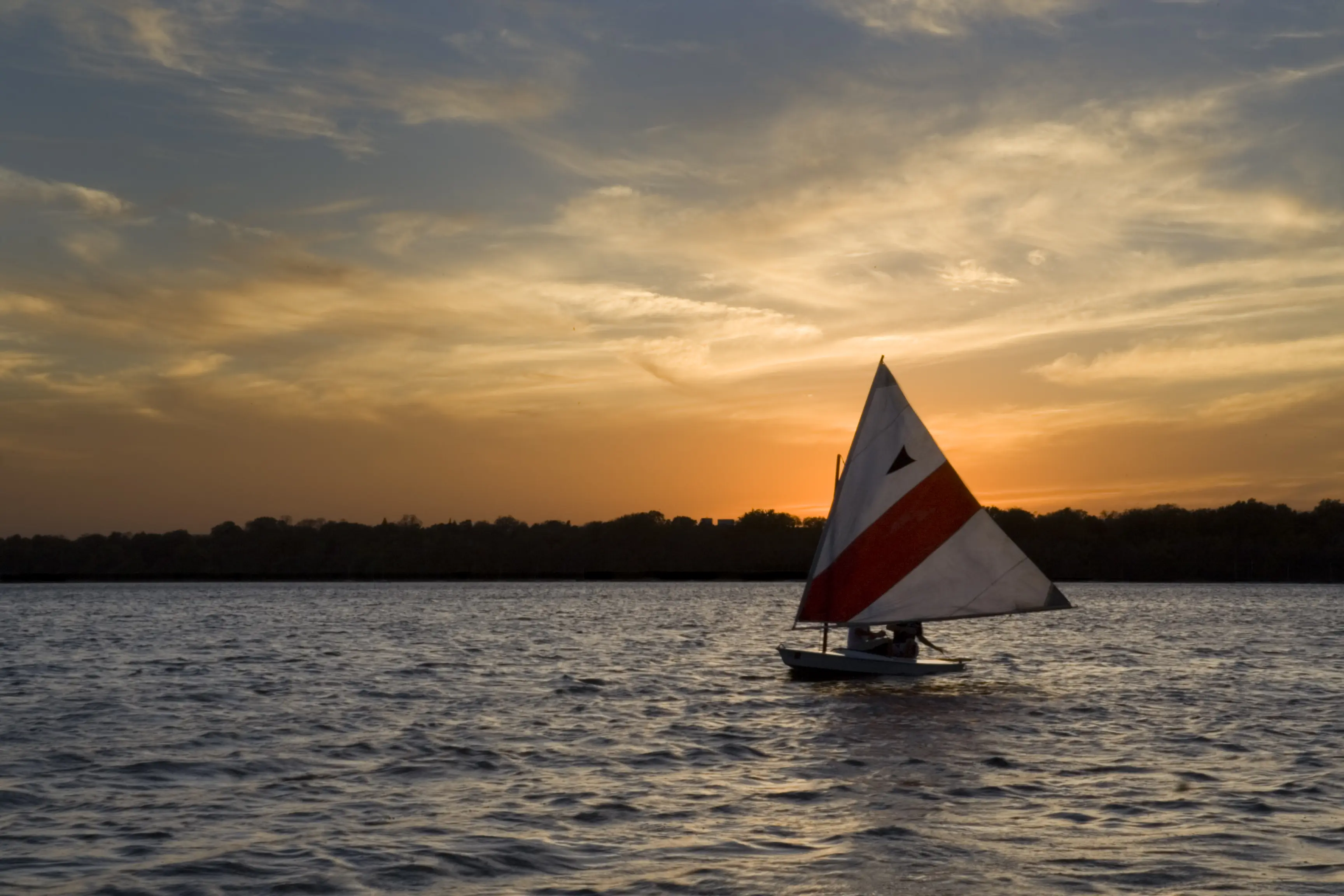 Image of a sailboat on Lake Harriet in Minnesota.