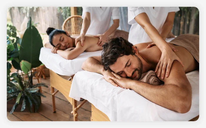 A couple getting a back massage together