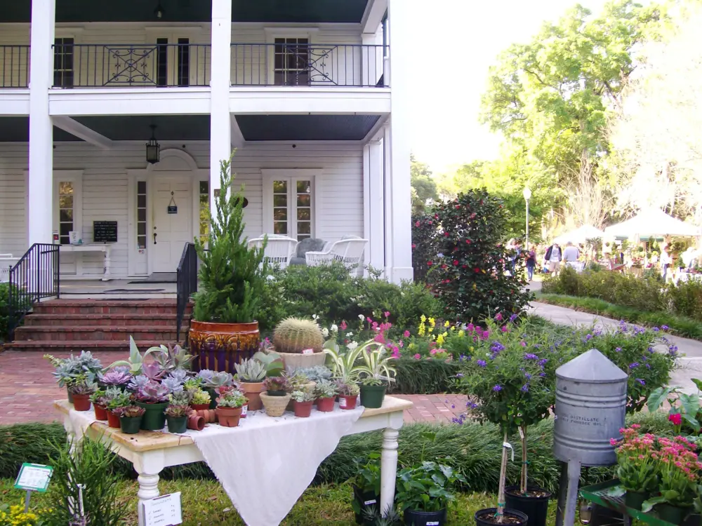 Leu House Museum with table of colorful flower and plant arrangements