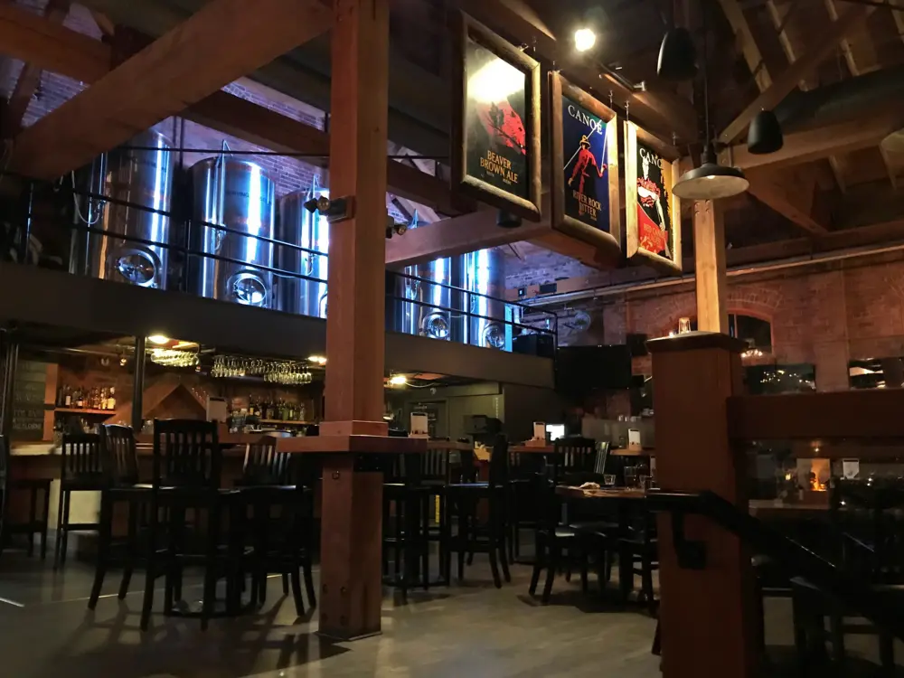 Timber and brick interior at CANOE Brewpub in Victoria, British Columbia.
