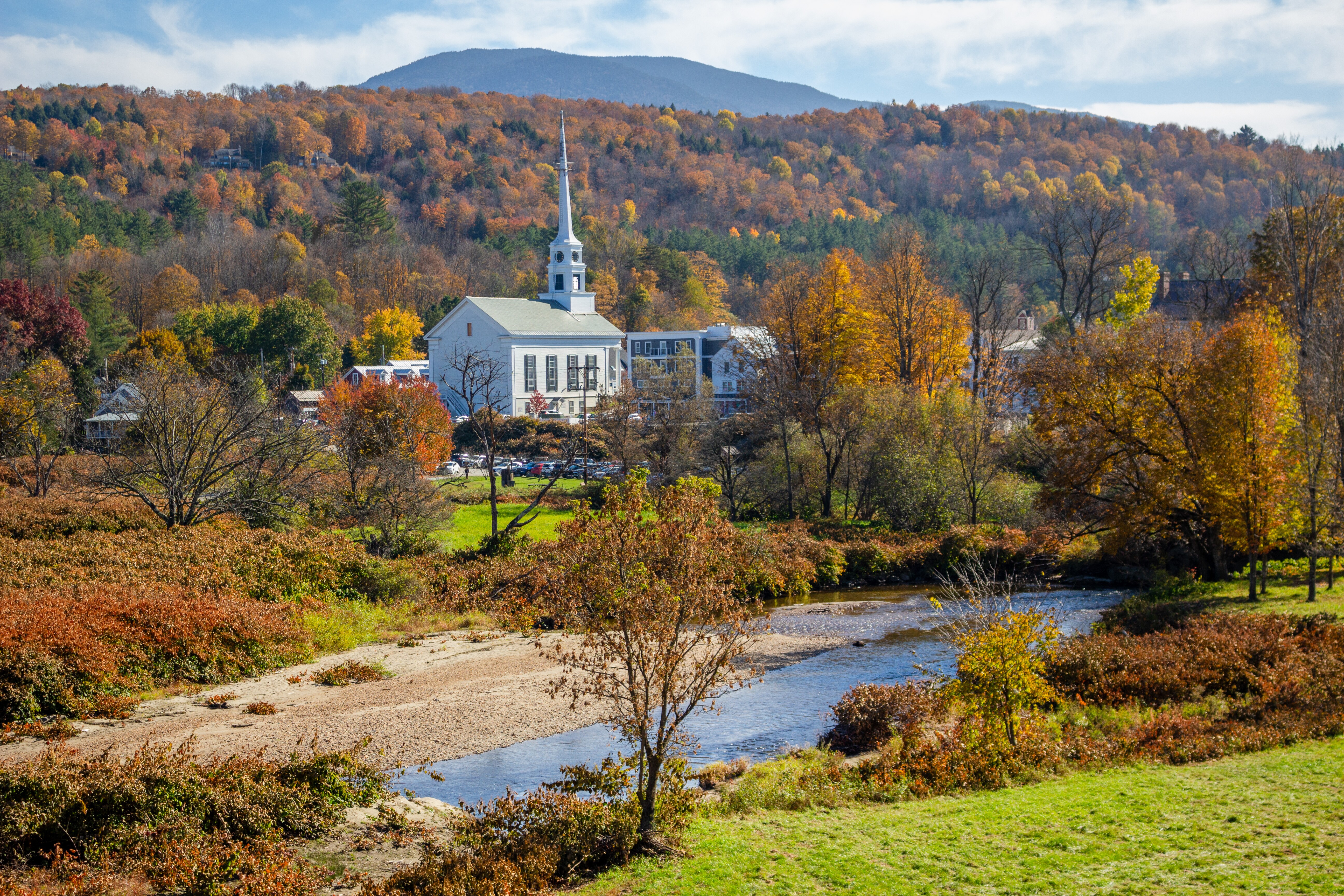 Image of an autumn view looking toward the Little River and the town of Stowe, Vermont.