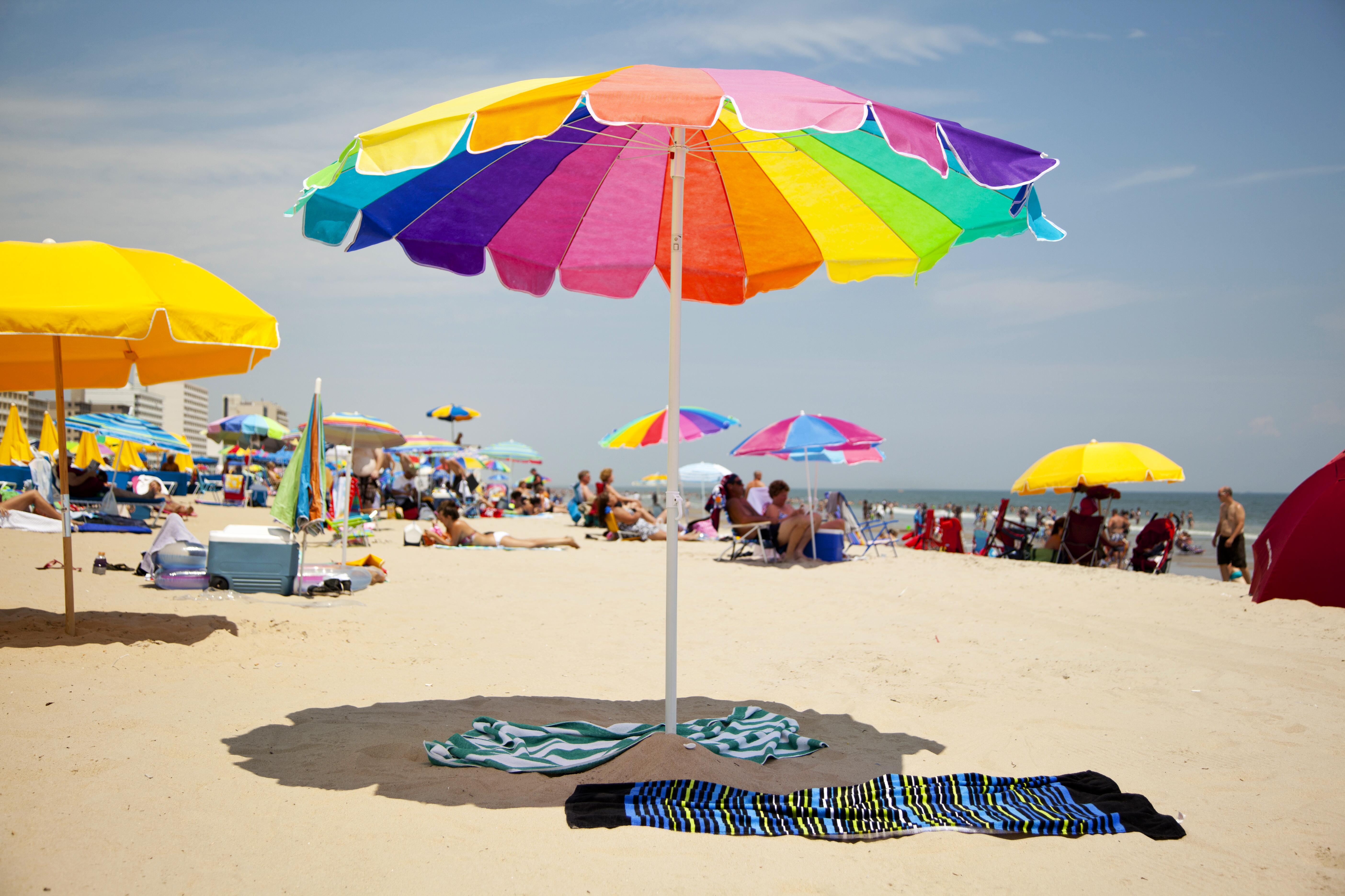 Beachgoers and colorful umbrellas at Virginia Beach
