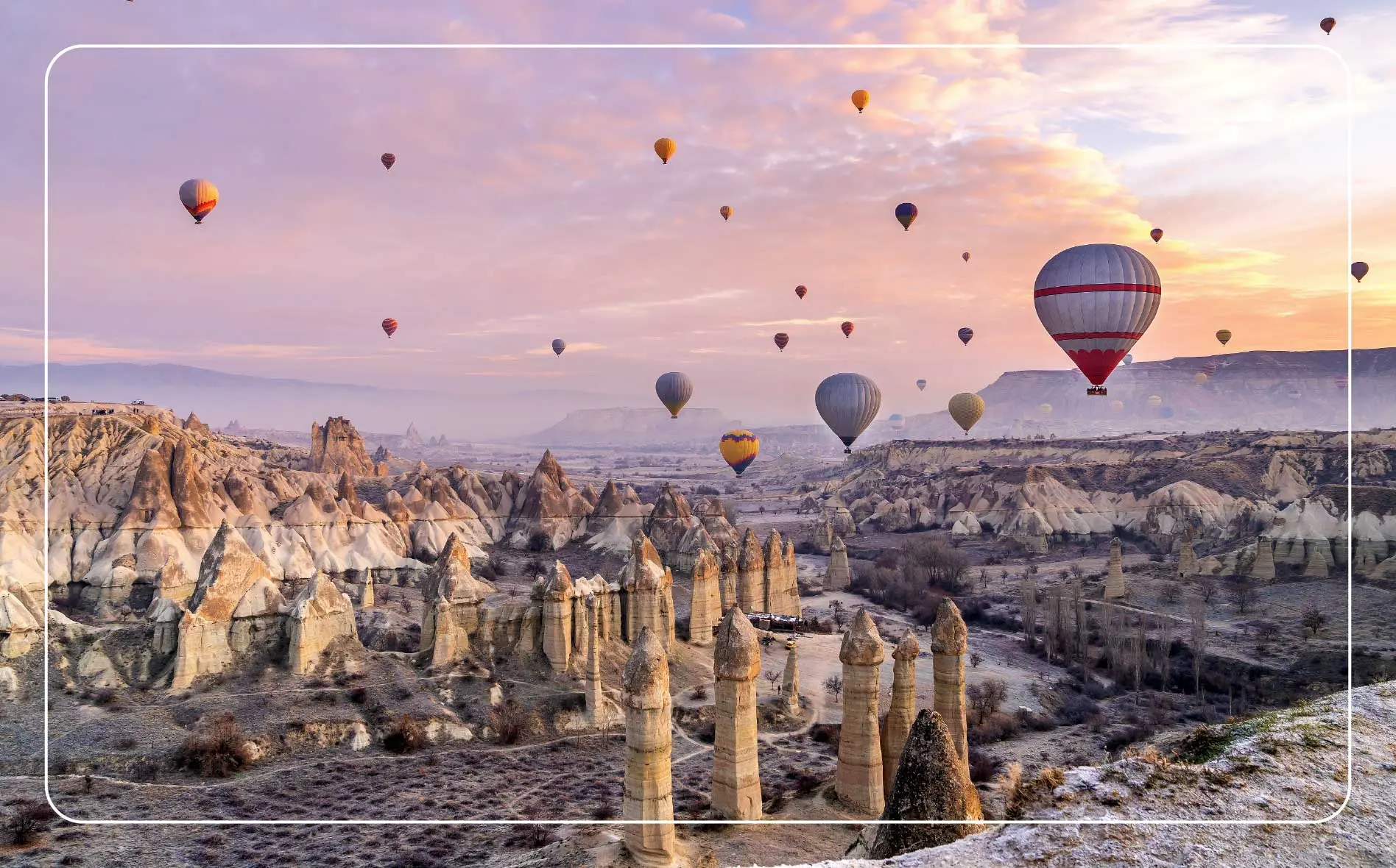 Colorful hot air balloons flying over Cappadocia, Turkey.