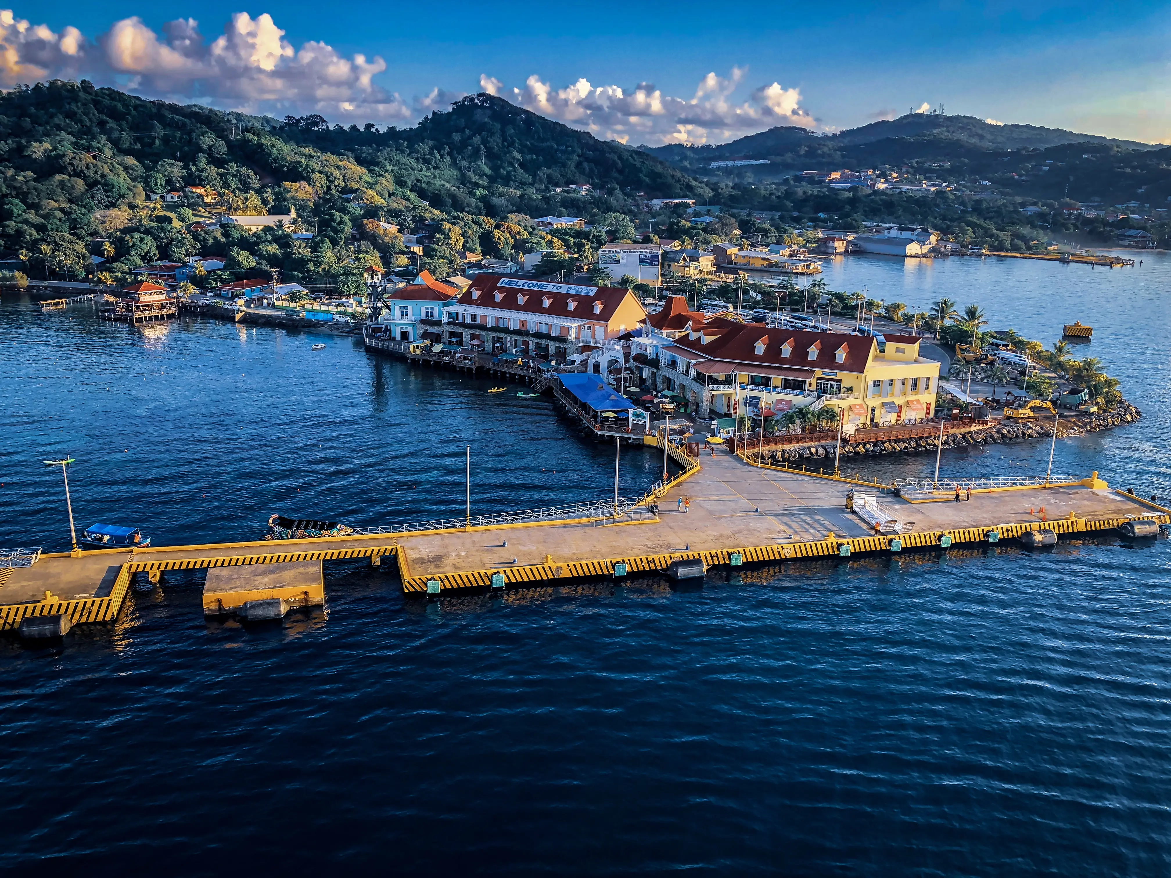Outdoor image of a dock and shops on Roatan..