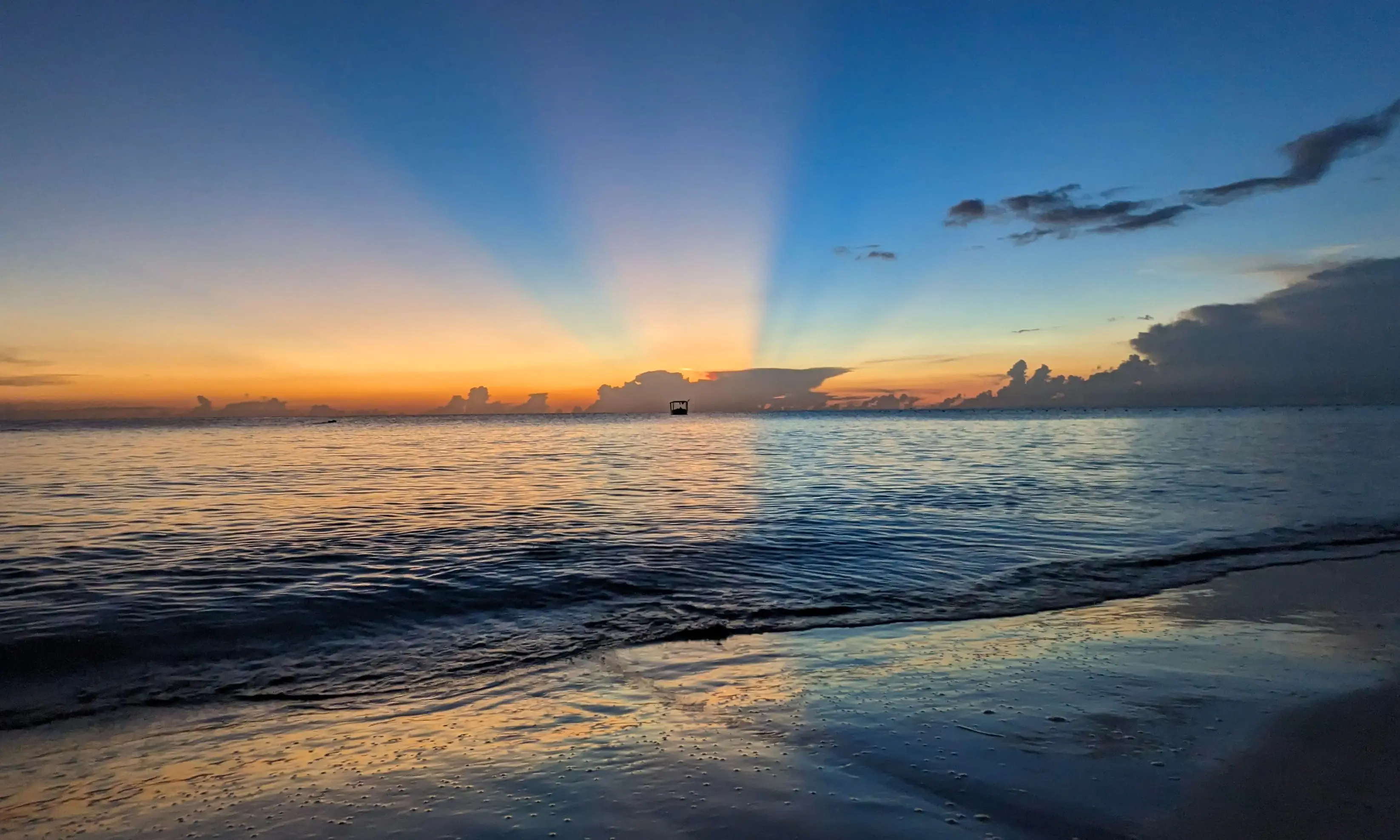 Image of a beach in Negril, Jamaica, at sunset.
