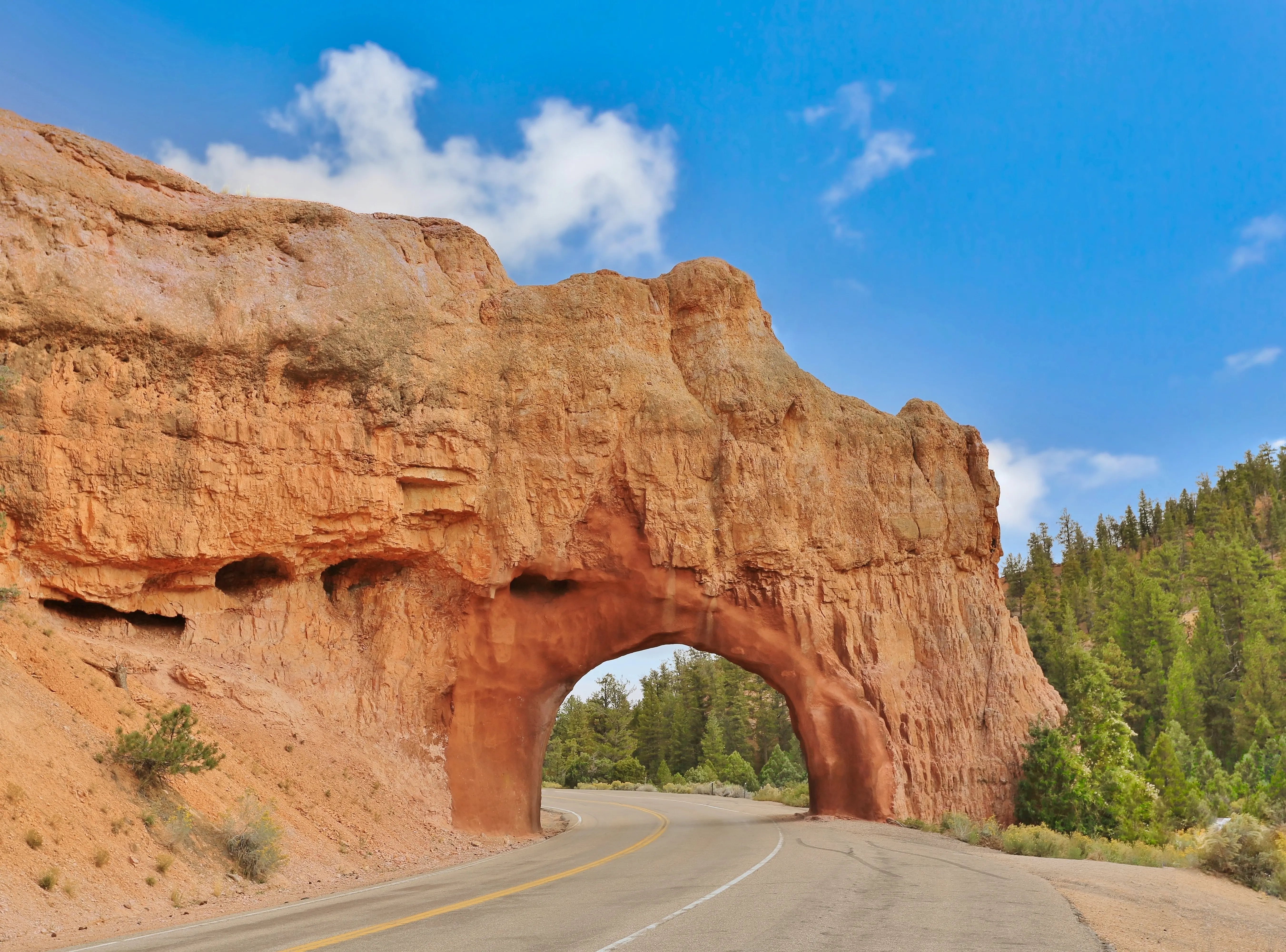 Image of Red Canyon Arch, over the Utah State Highway 12 Scenic Byway between Panguitch and Bryce Canyon City, Utah.