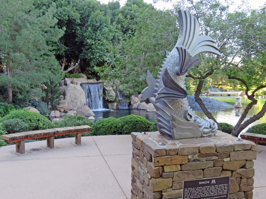 Waterfall and sculpture in the Japanese Friendship Garden of Phoenix in Phoenix, Arizona