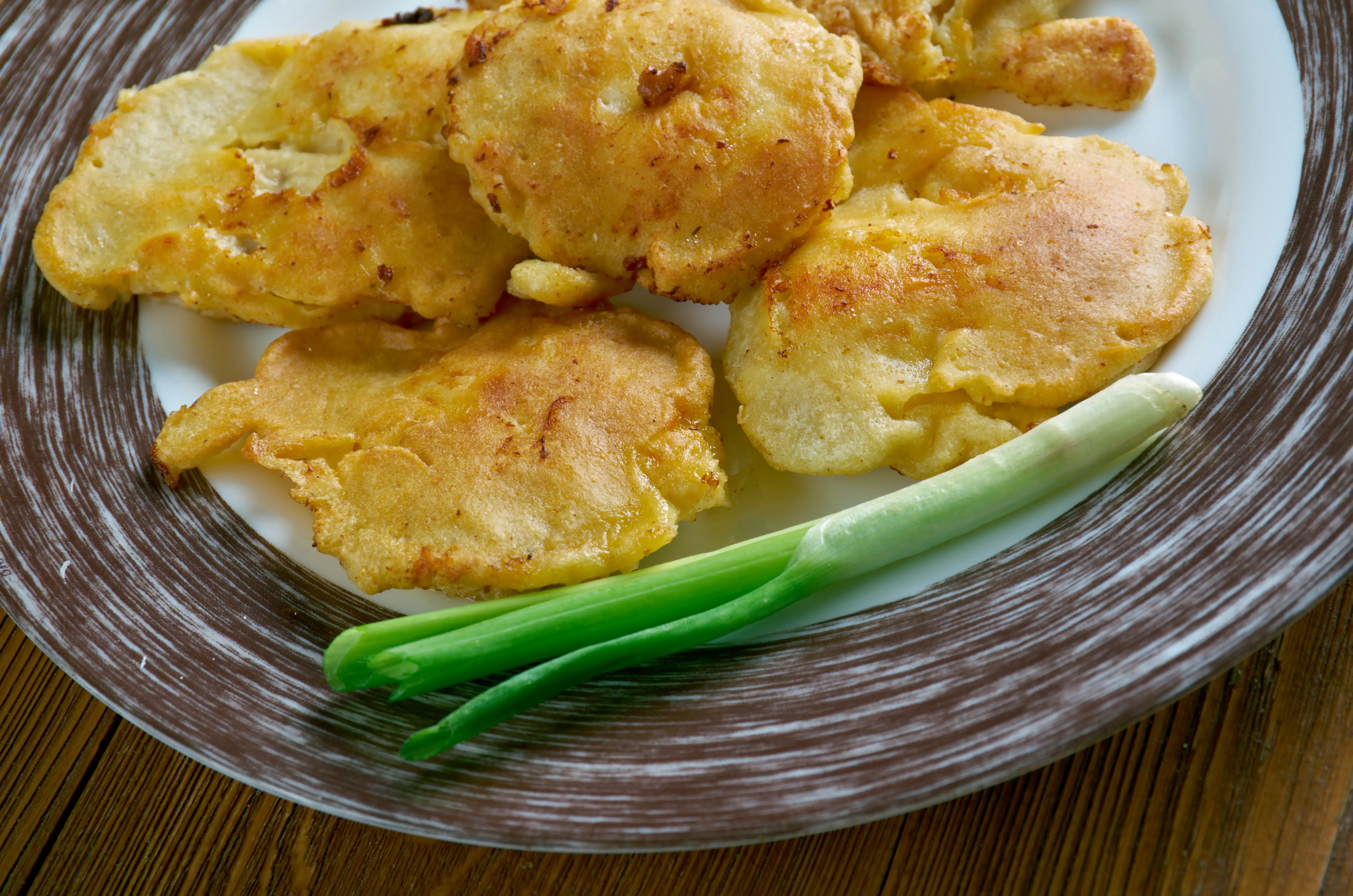 Image of fried pancake-like fritters on a plate.