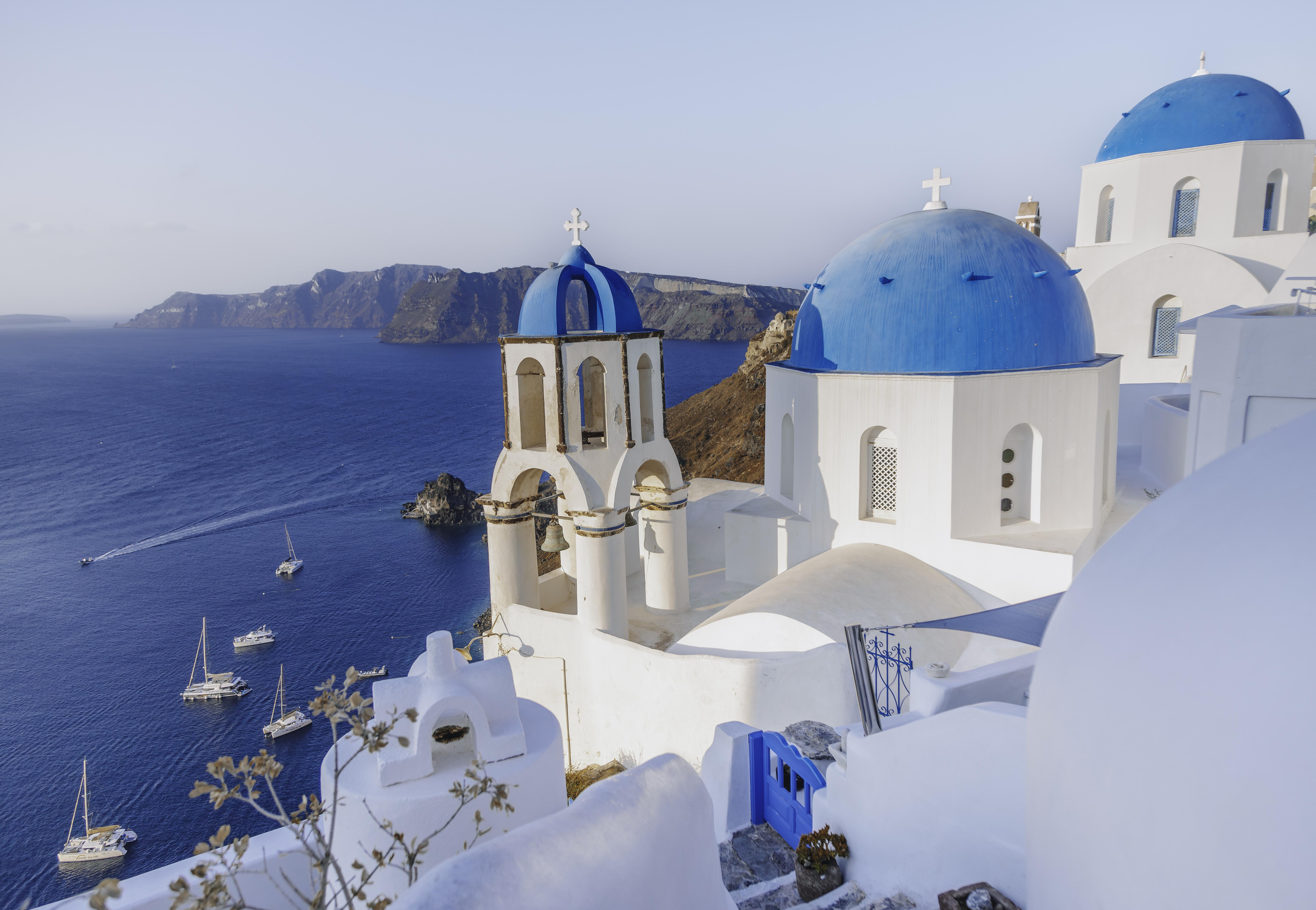 Photo of the Blue domed churches in Santorini, Greece