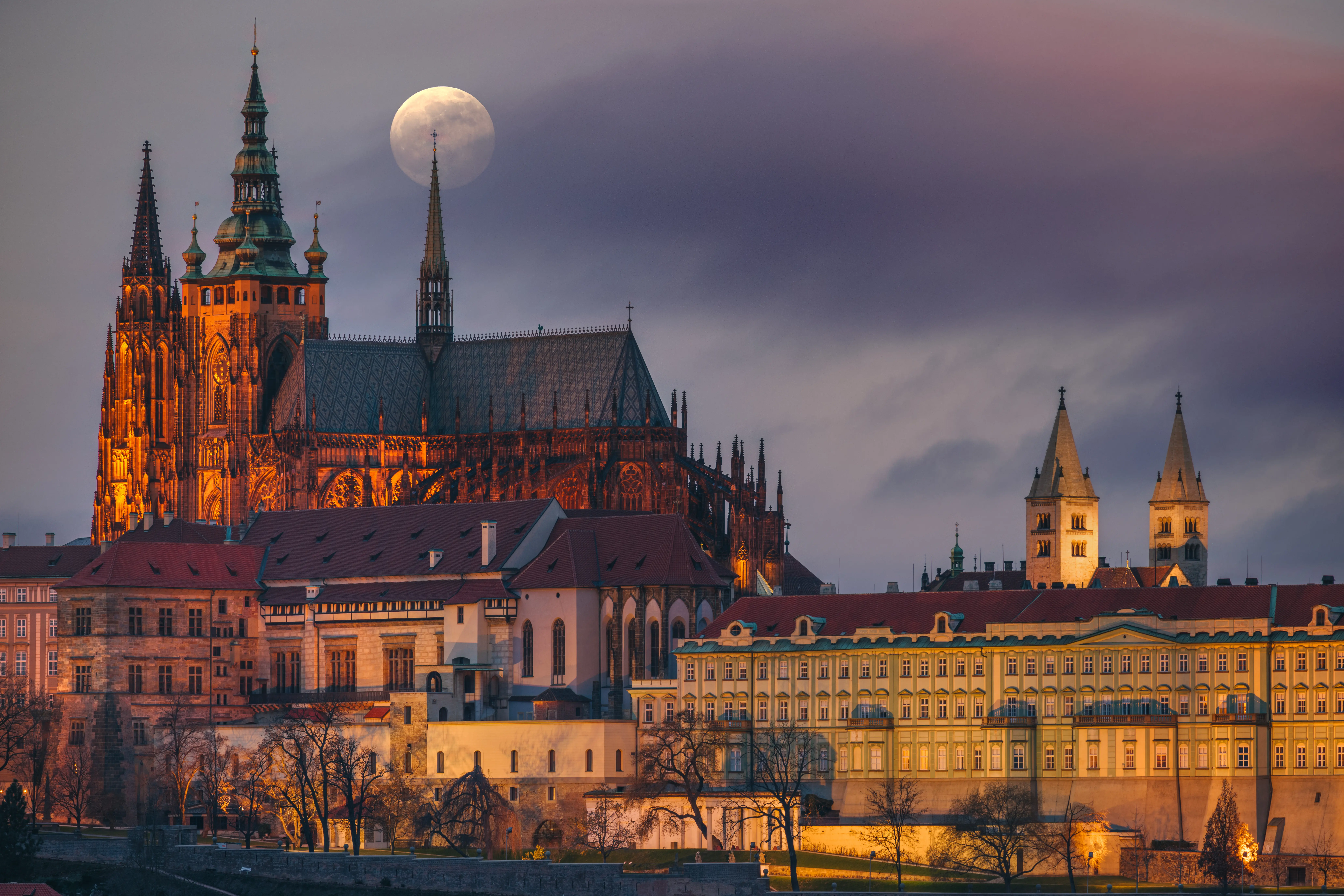 Exterior nighttime image of the skyscape surrounding St. Vitus Cathedral, in Prague.
