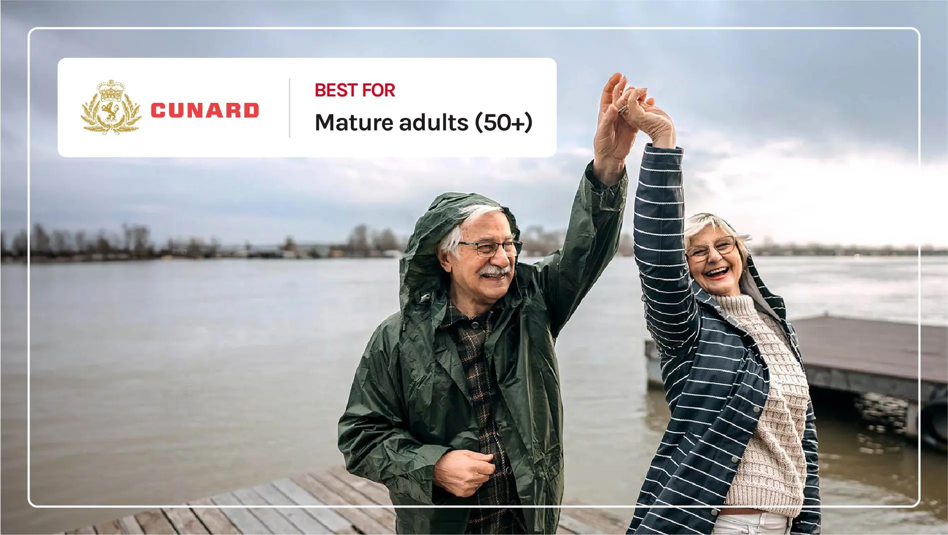 An older couple dancing on a dock in the rain.