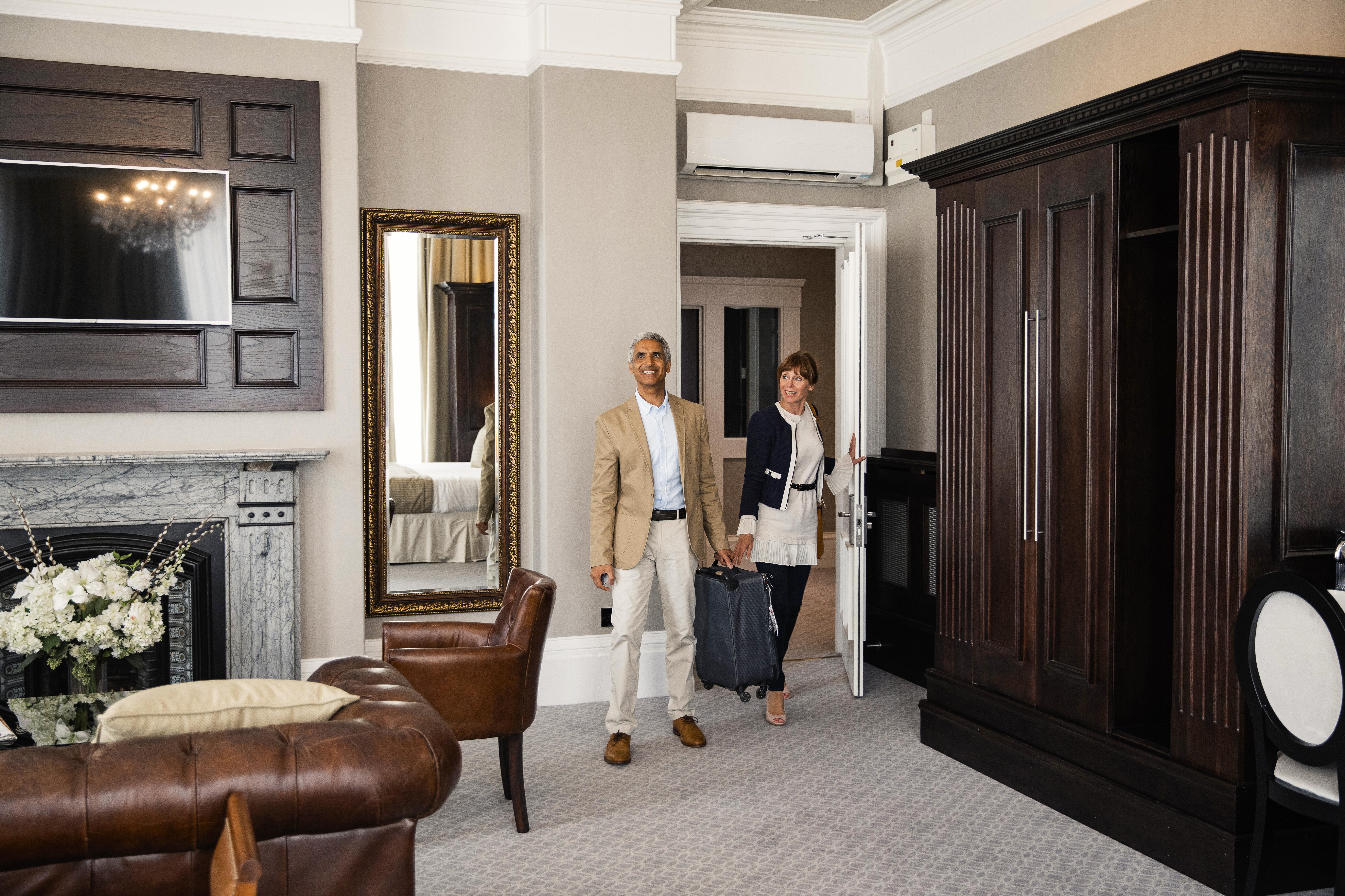 Couple entering their hotel suite