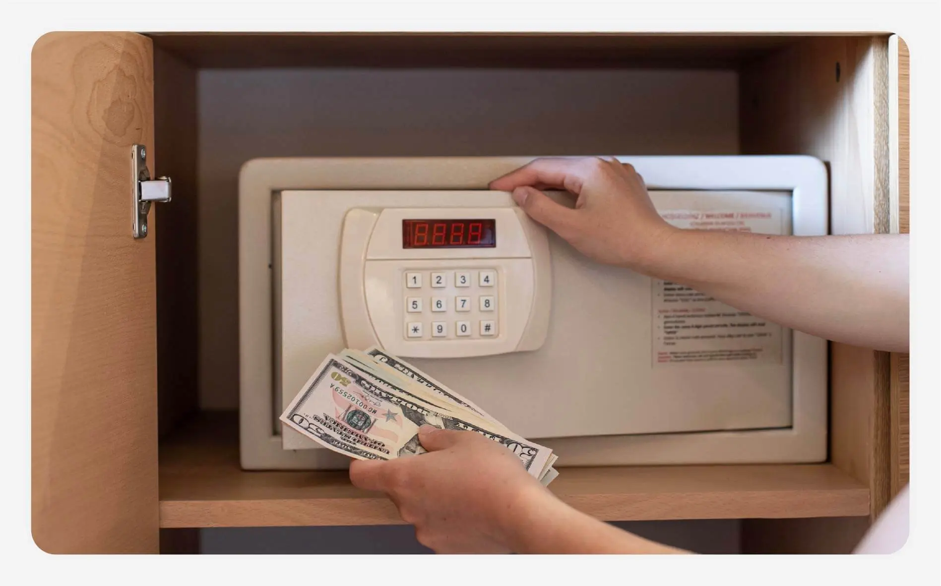 Solo female traveler putting cash in a safe