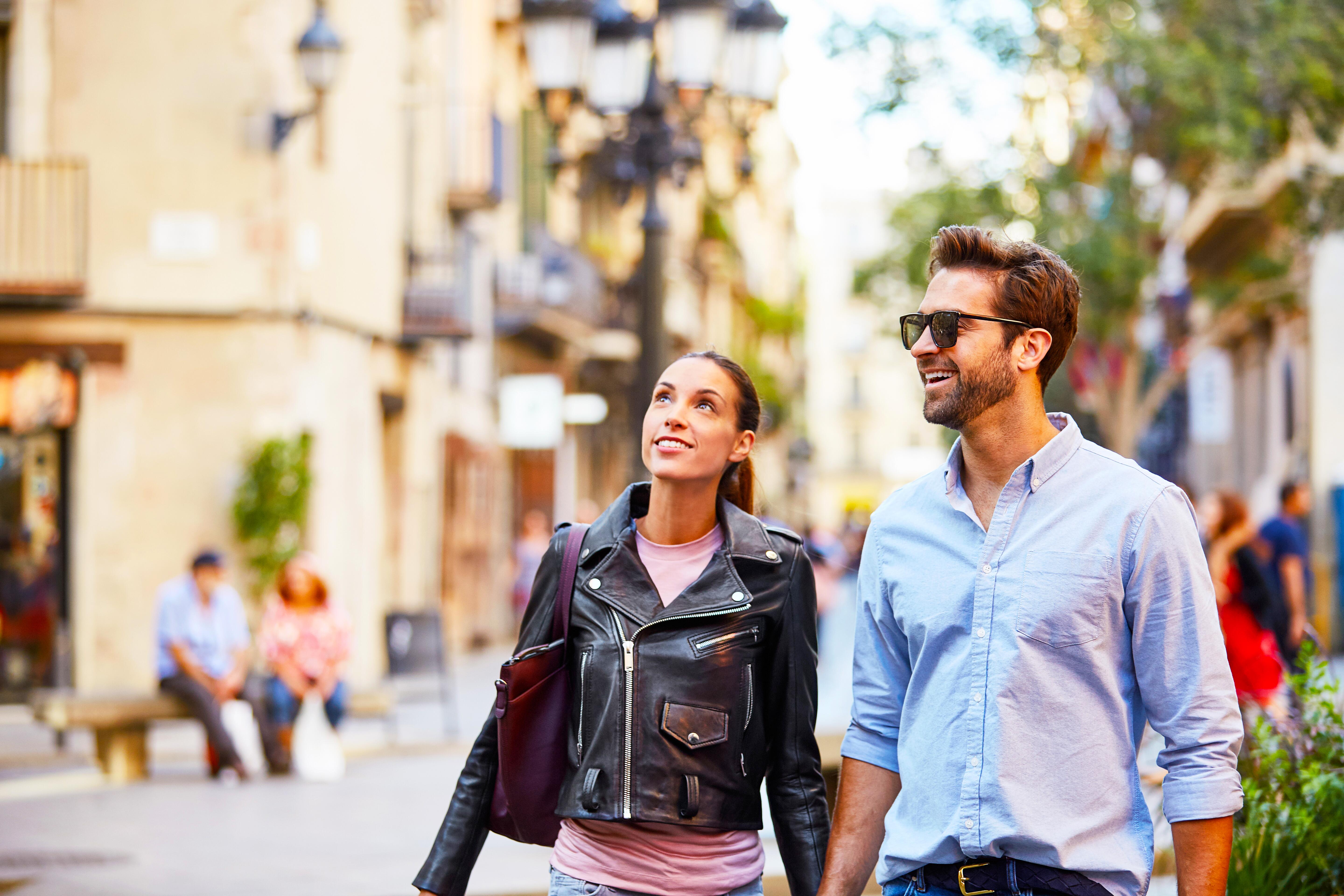 Young couple walking and sightseeing together in the city