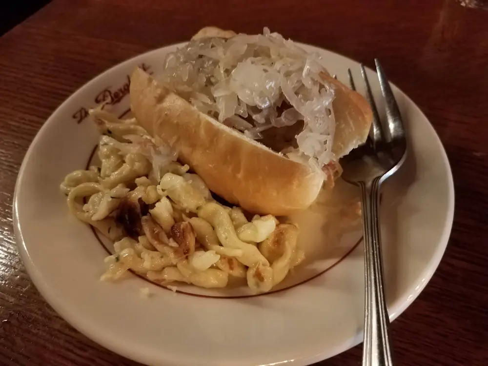 Bratwurst and spatzle at The Berghoff during the Famous Tastes of Chicago walking tour.