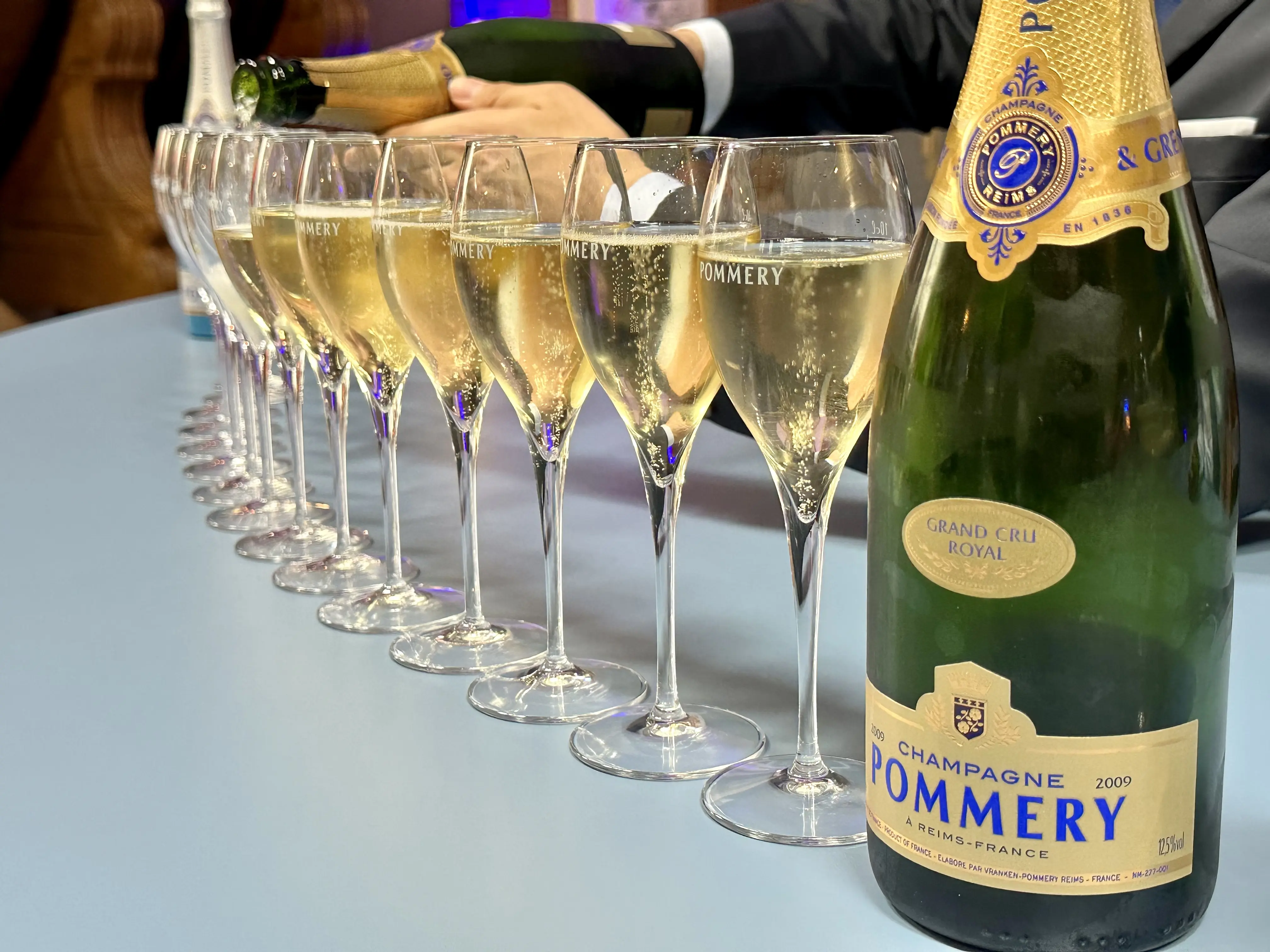 Image of glasses of champagne being poured for a tasting.