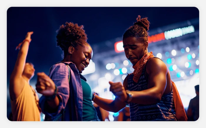 A couple dancing together at a music festival