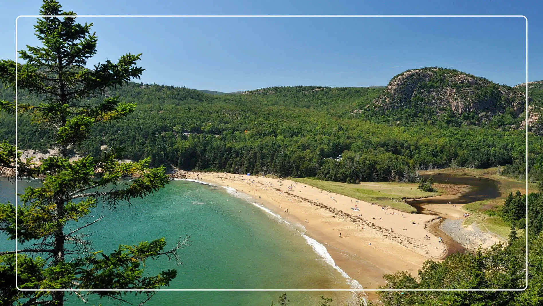 An aerial view of Sand Beach inside Acadia National Park.