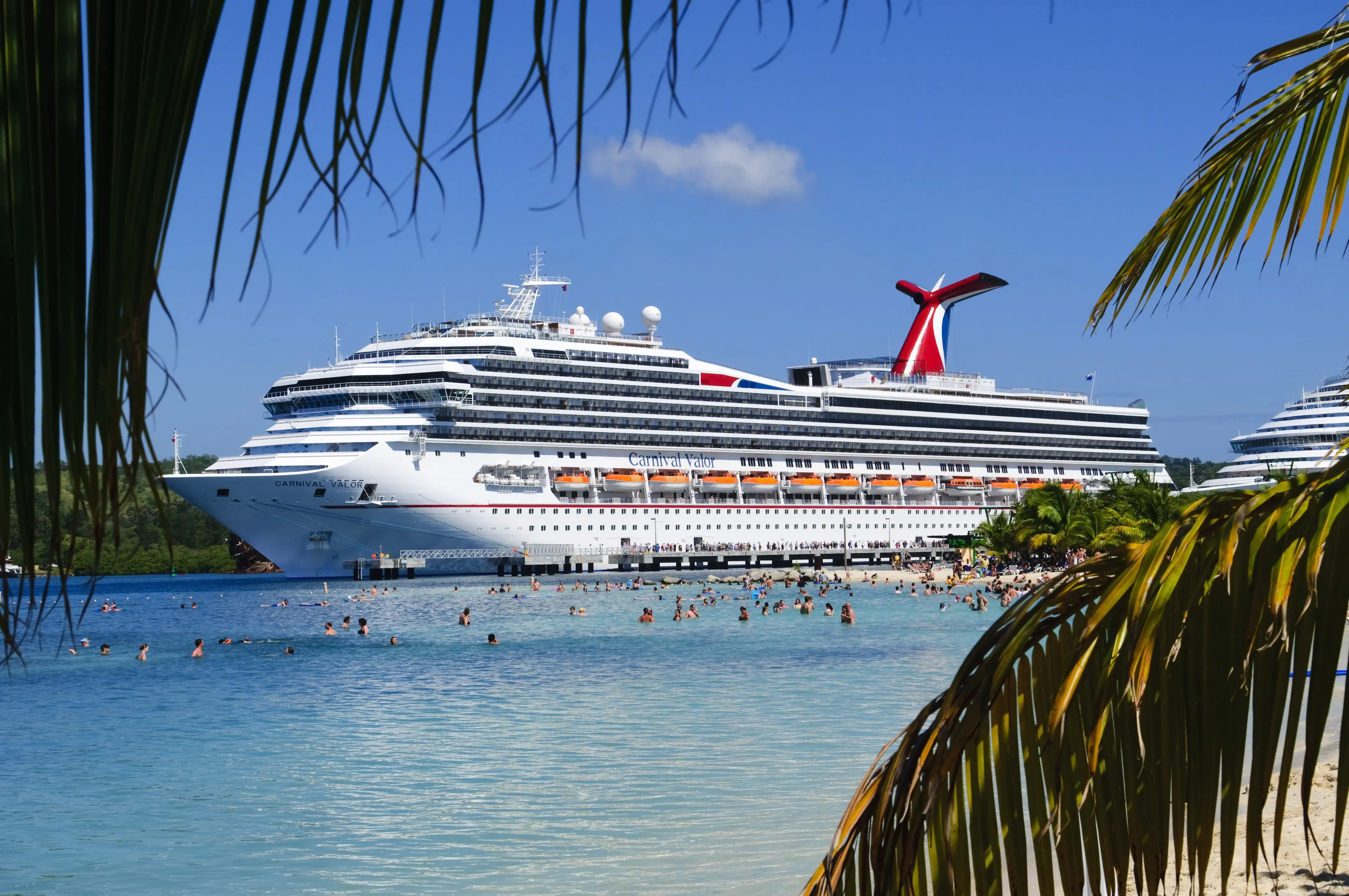Image of The M.S. Carnival Valor, docked at Mahogany Bay on the Caribbean island of Roatan.