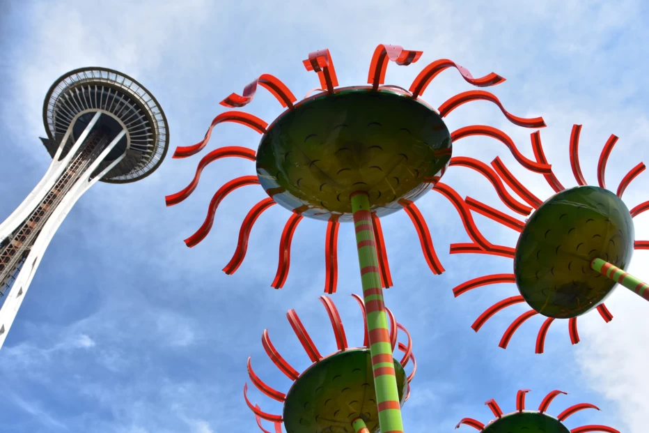 View looking up at the Space Needle and glass flower sculptures from the ground in Seattle, Washington.