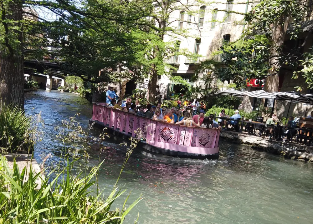 Tour boat along San Antonio River Walk.