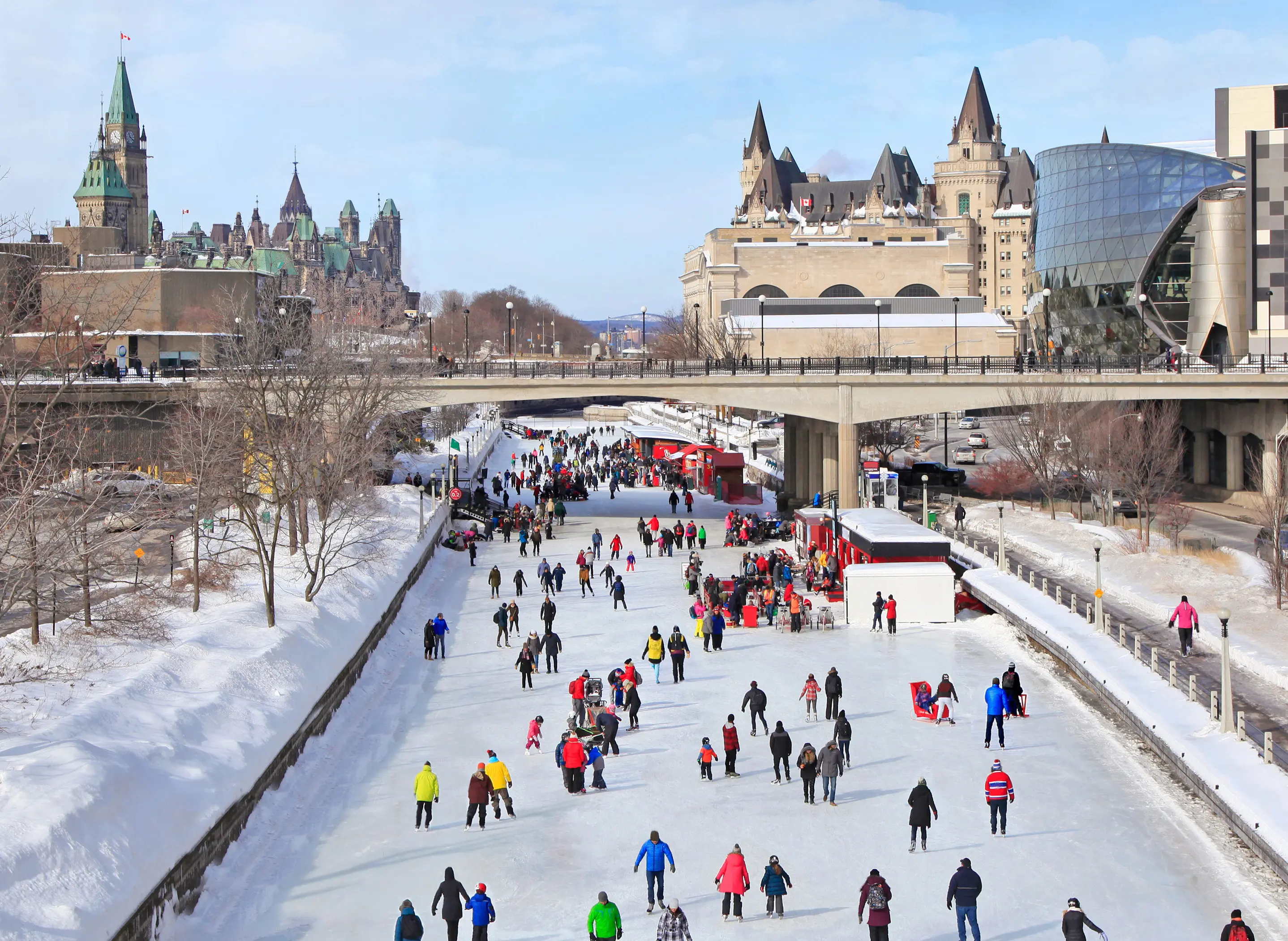 Crowd of people ice skating on Rideau Canal during in winter, Ottawa, Canada