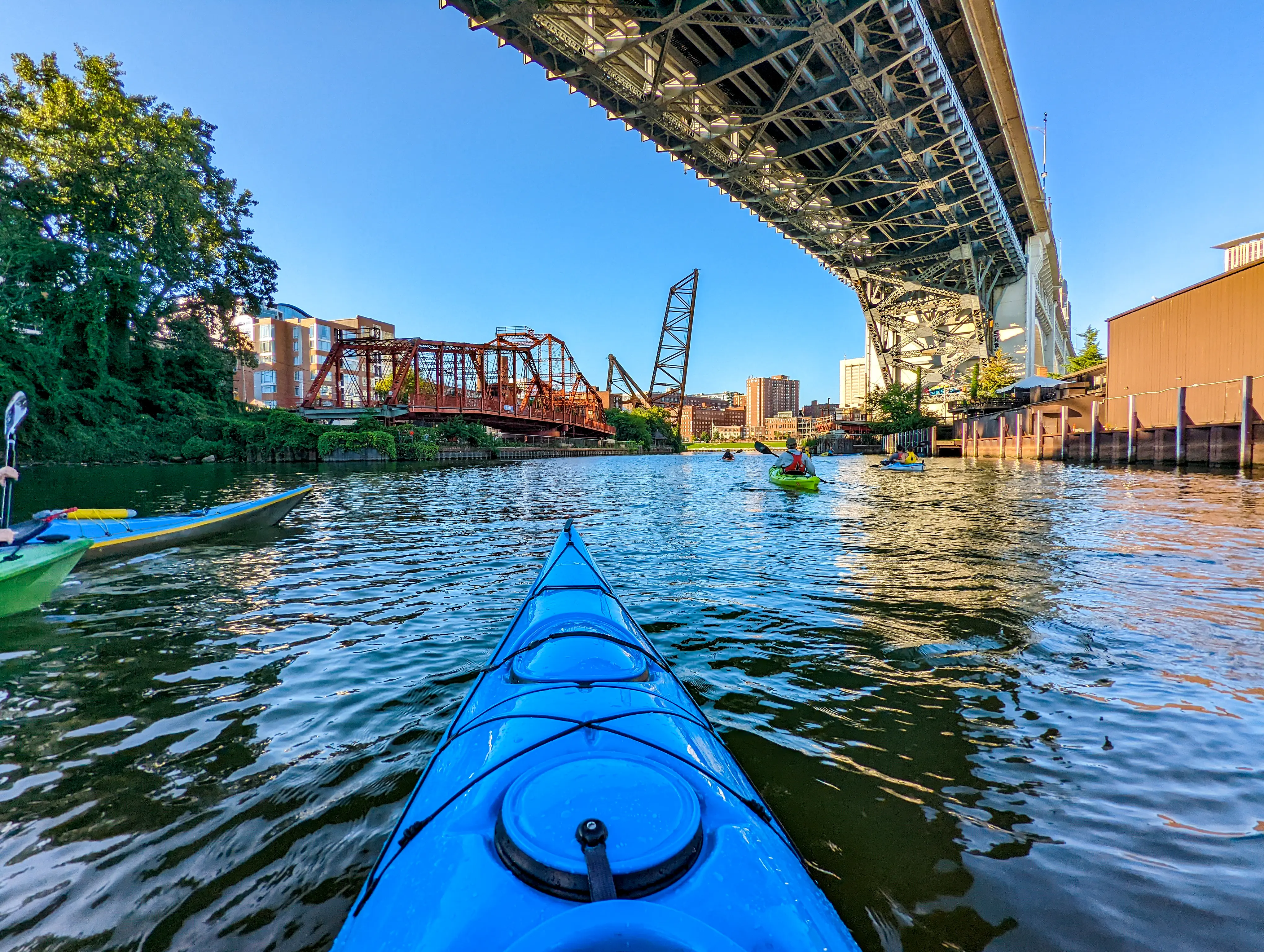 Point of view from kayak under a bridge in urban river, Cleveland, OH
