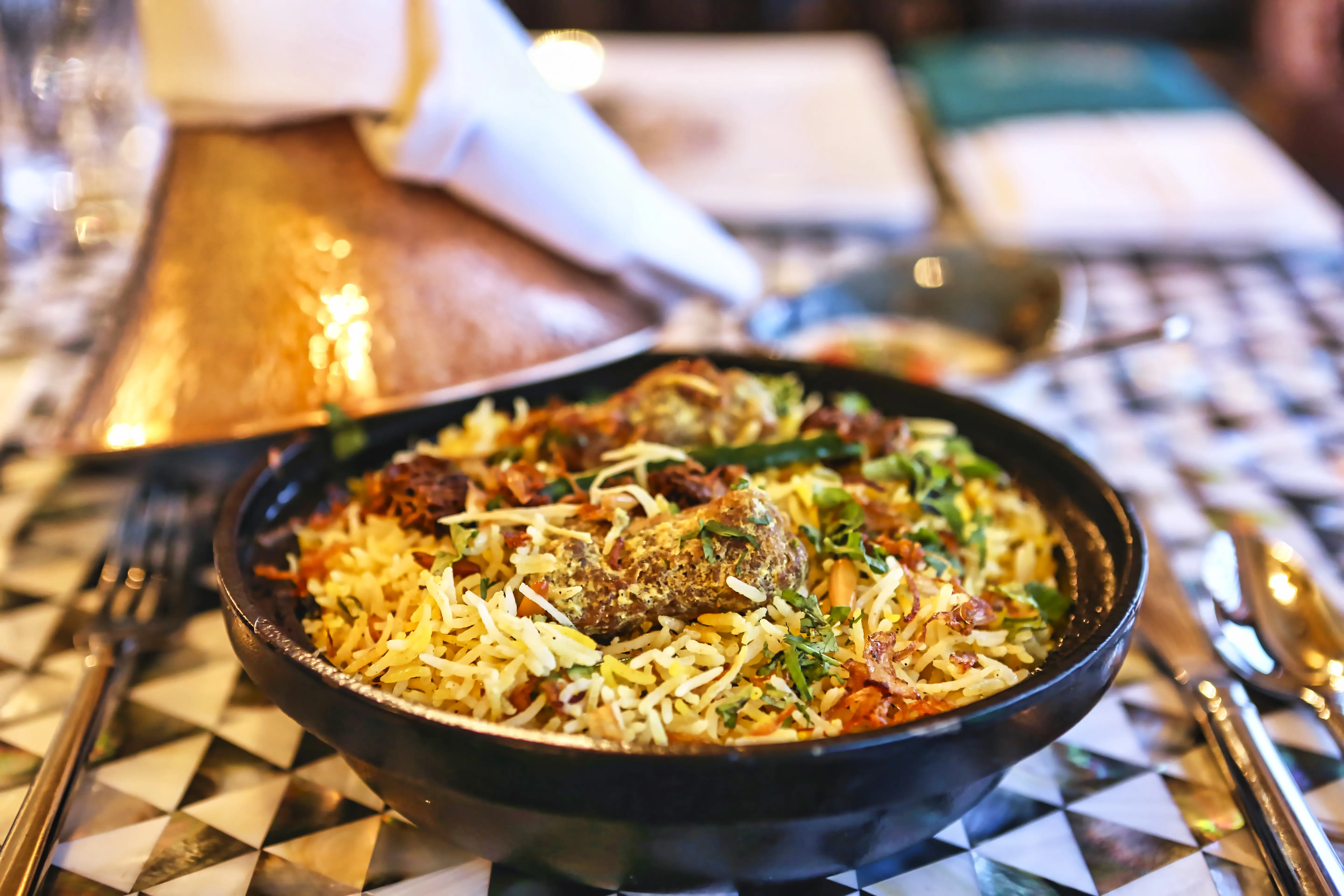Vegetarian jackfruit (kathal) biryani dish served in traditional Indian copper handi