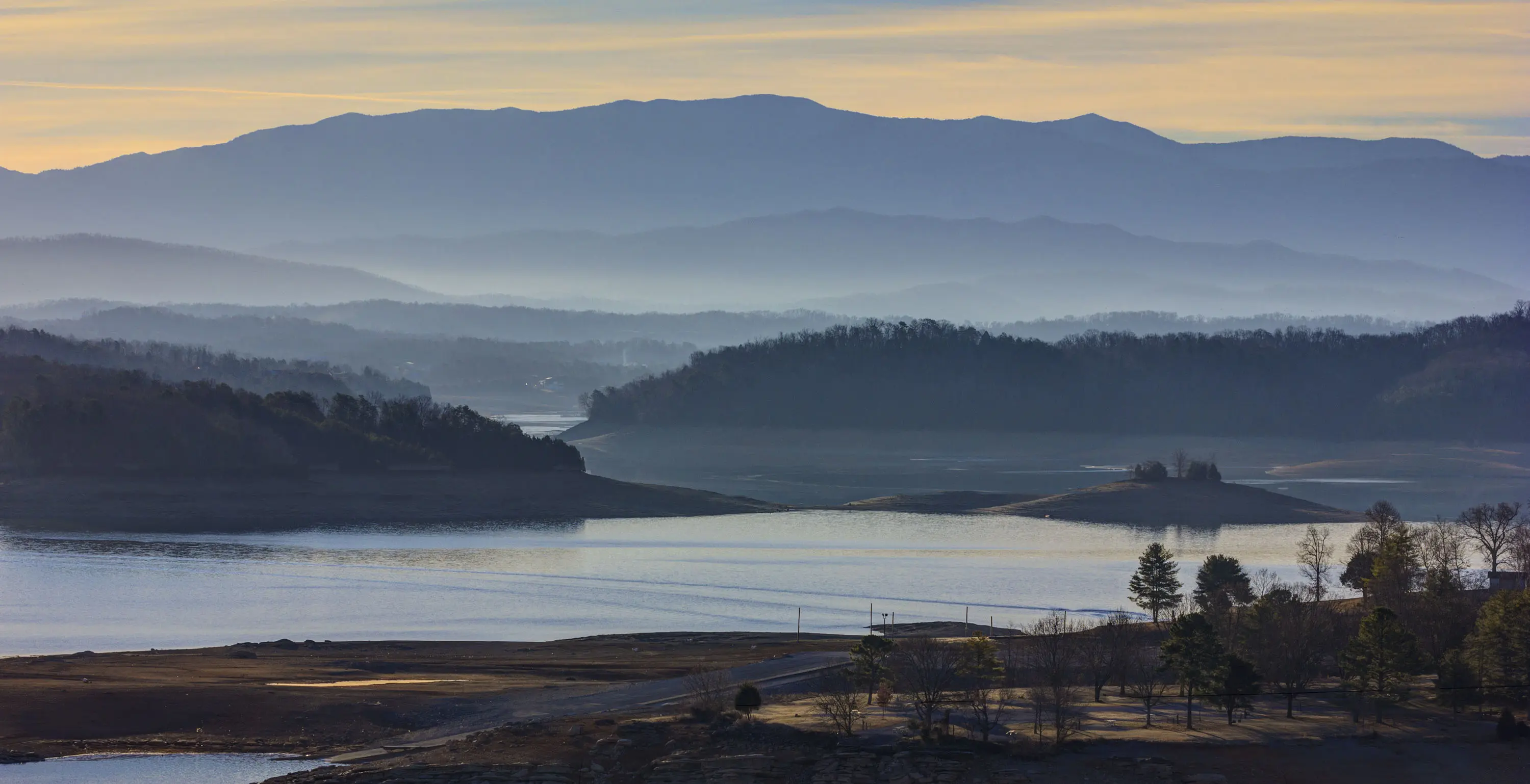 Image of Douglas Lake, with the smokies visible in the background.