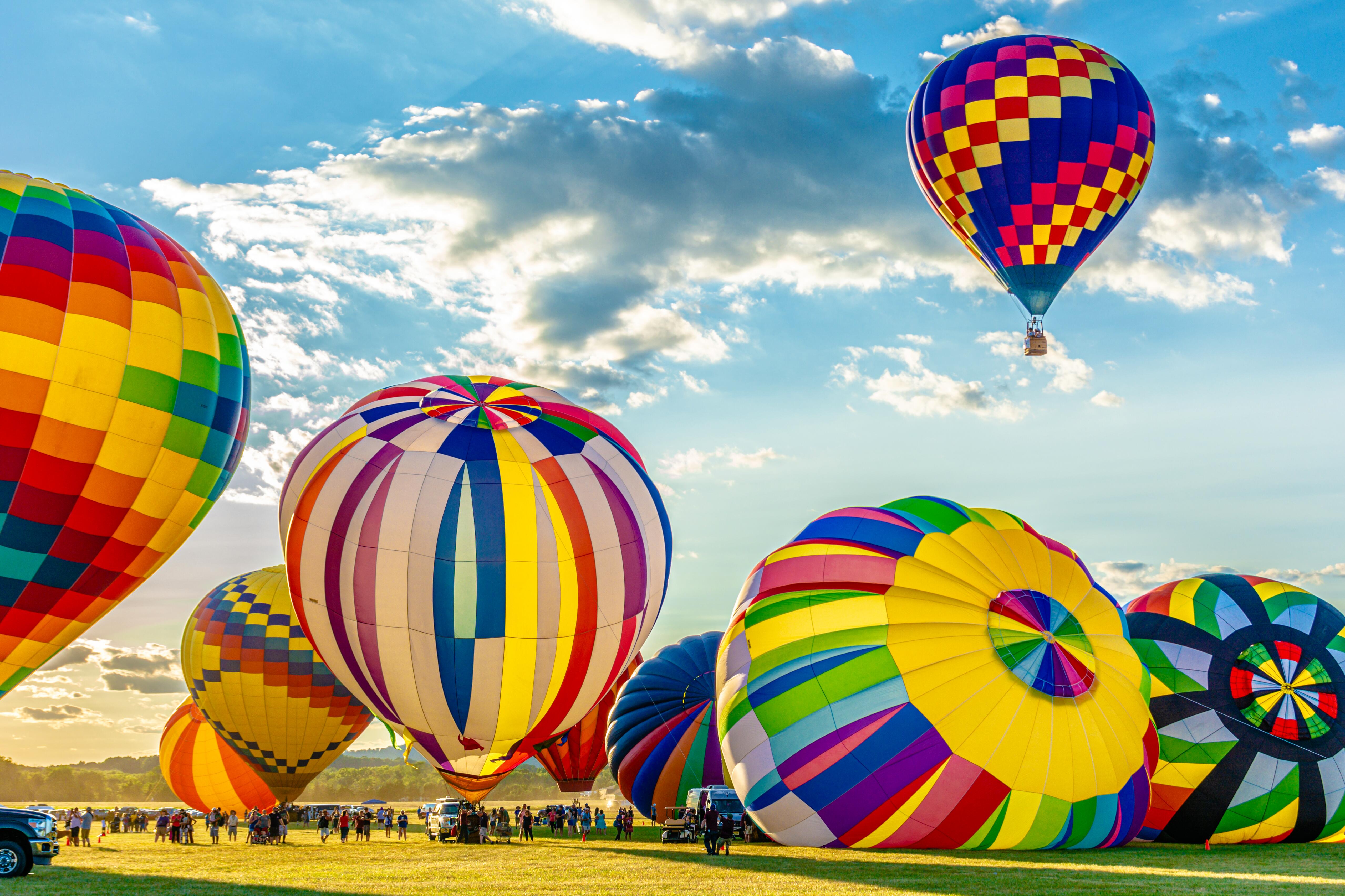Hot air balloon festival, colorful balloons preparing to take flight