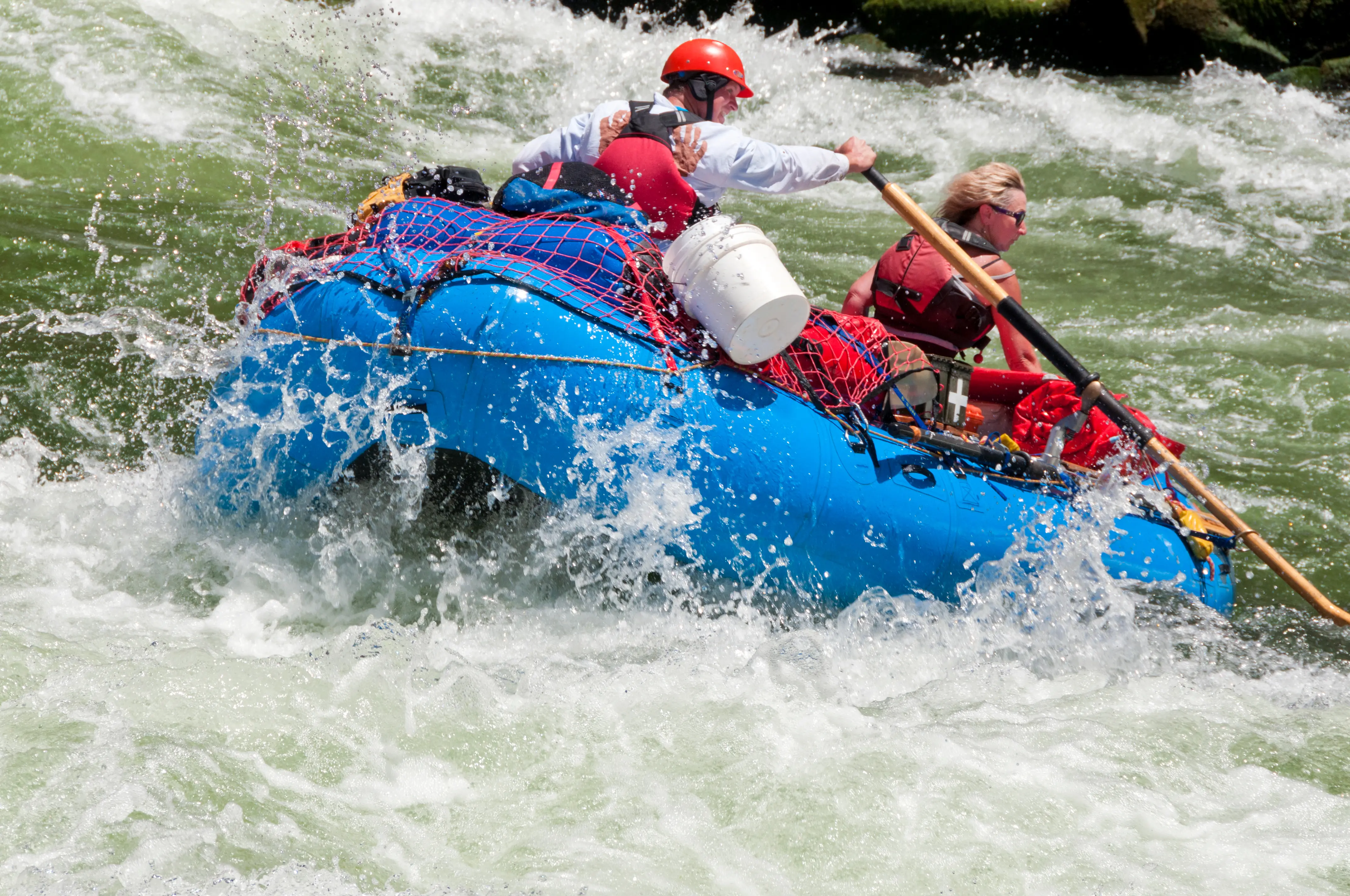 Determined oarsman guides raft with passenger through House Rock Rapid at mile 17 on the Colorado River, during a 200 mile, 16 day trip through the Grand Canyon