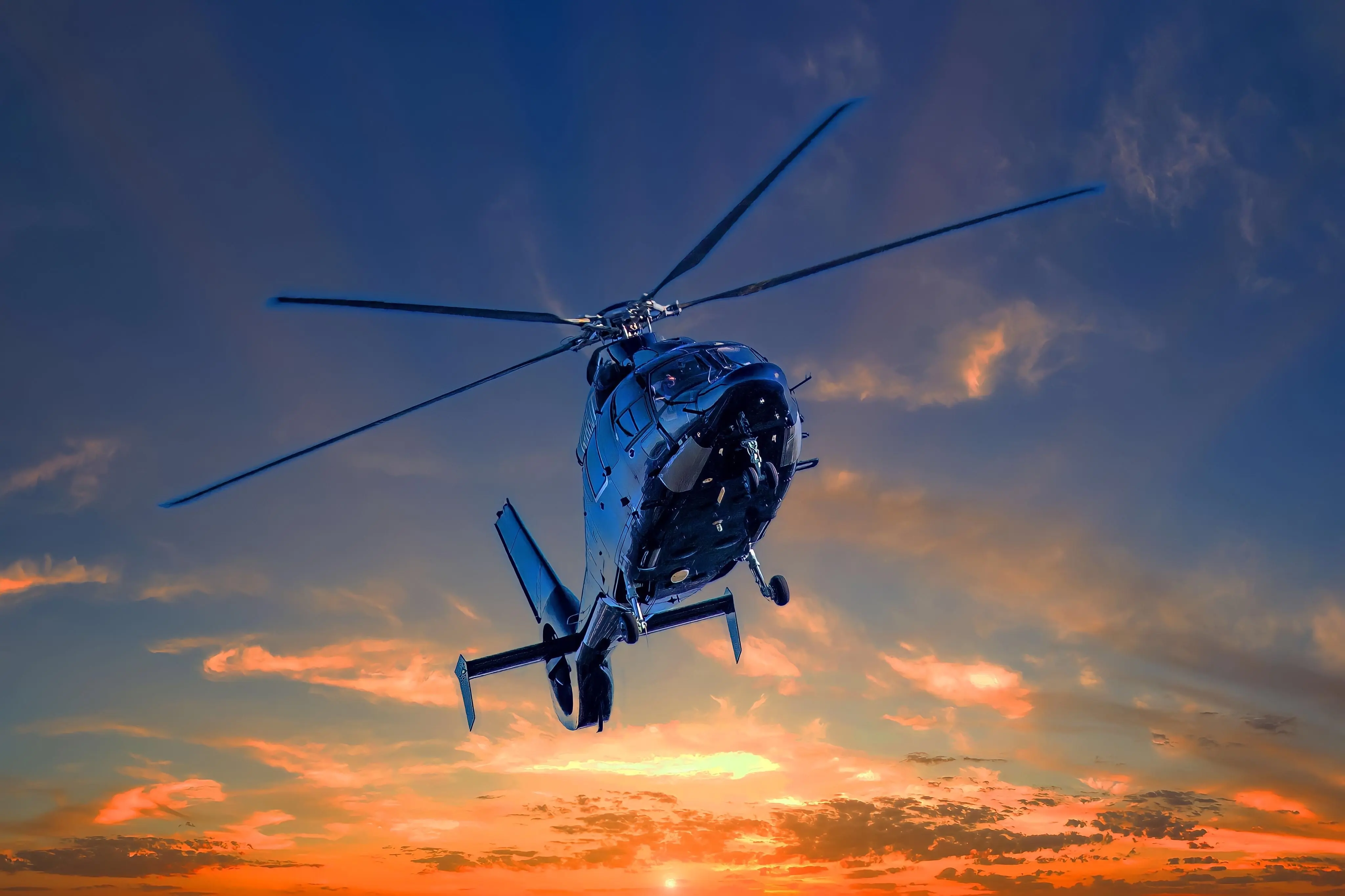 Image of a helicopter flying in the sky.