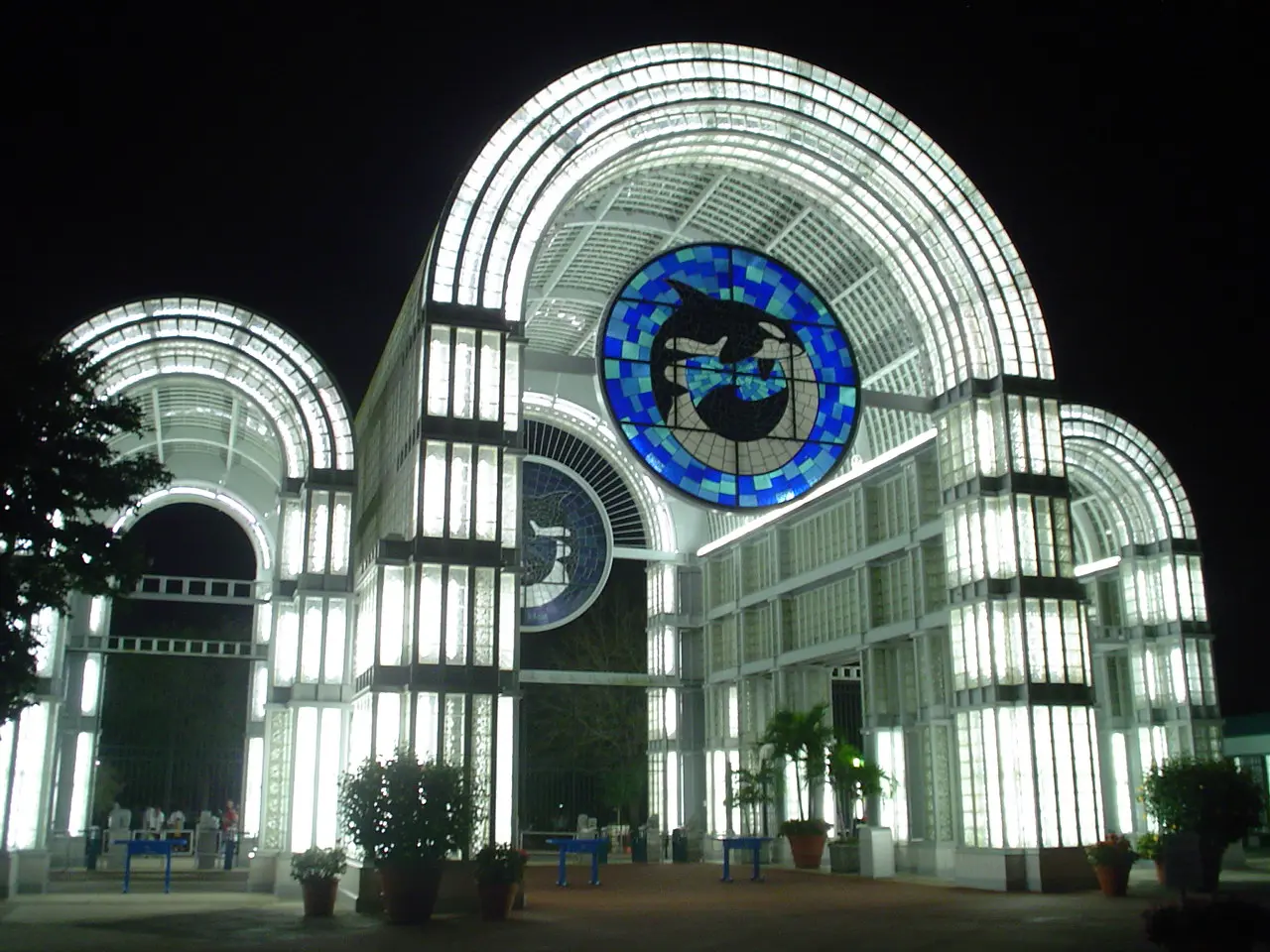 Image of the front entrance to SeaWorld San Antonio, lit up at night.