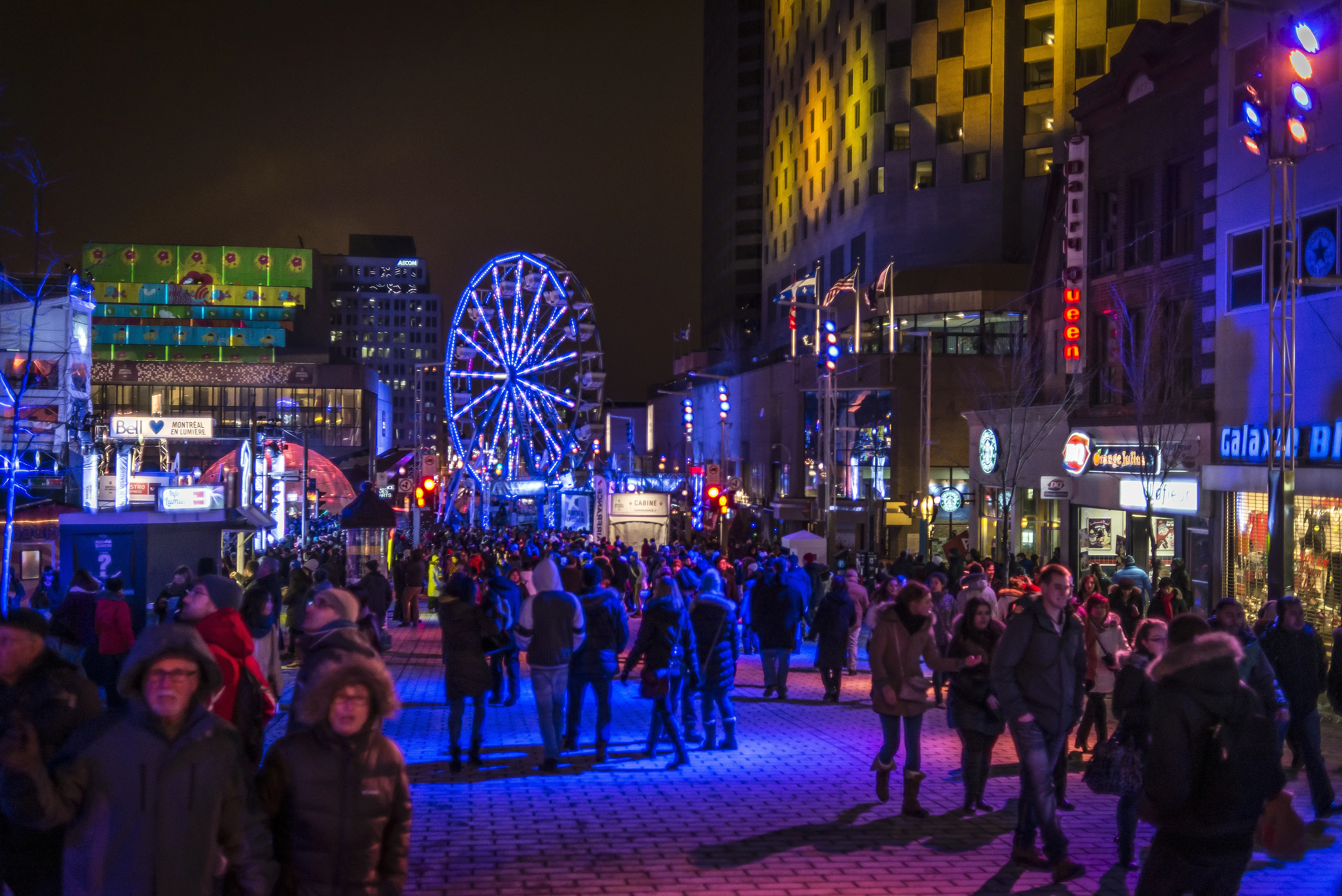 Image of people enjoying the festivities of Montréal En Lumières winter festival, in Montreal.