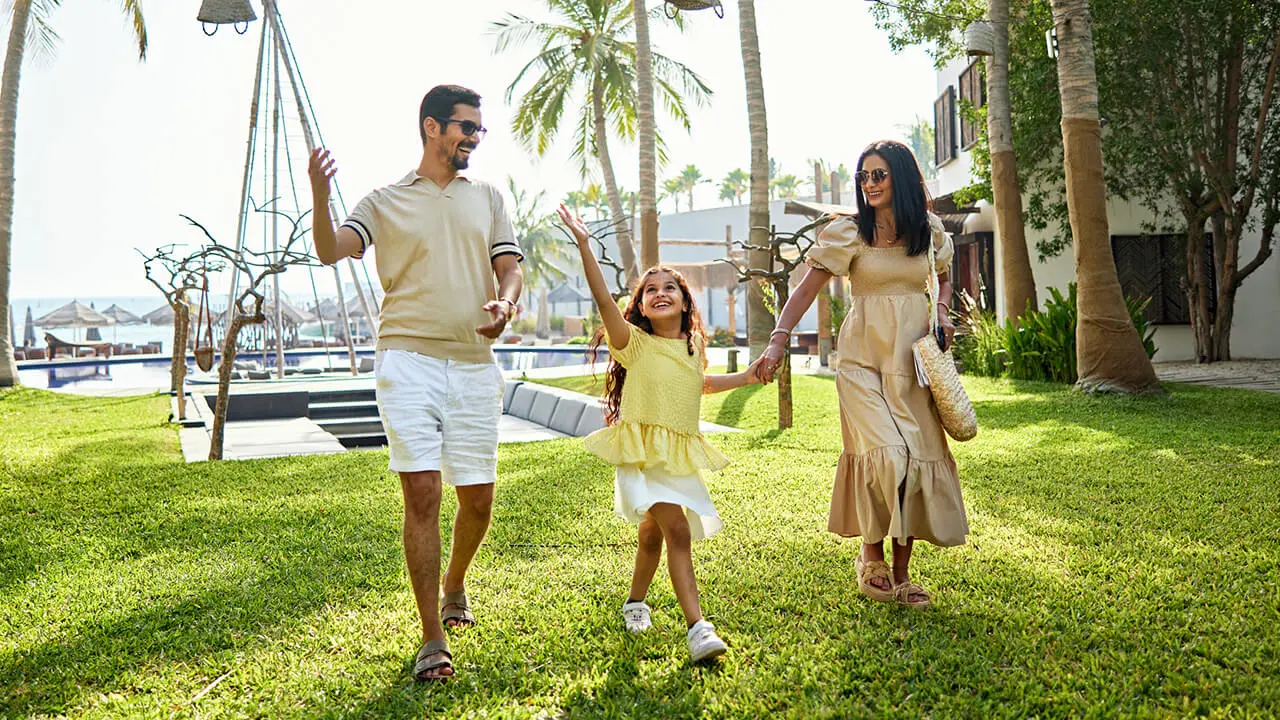 A couple walking around the grounds of a resort.