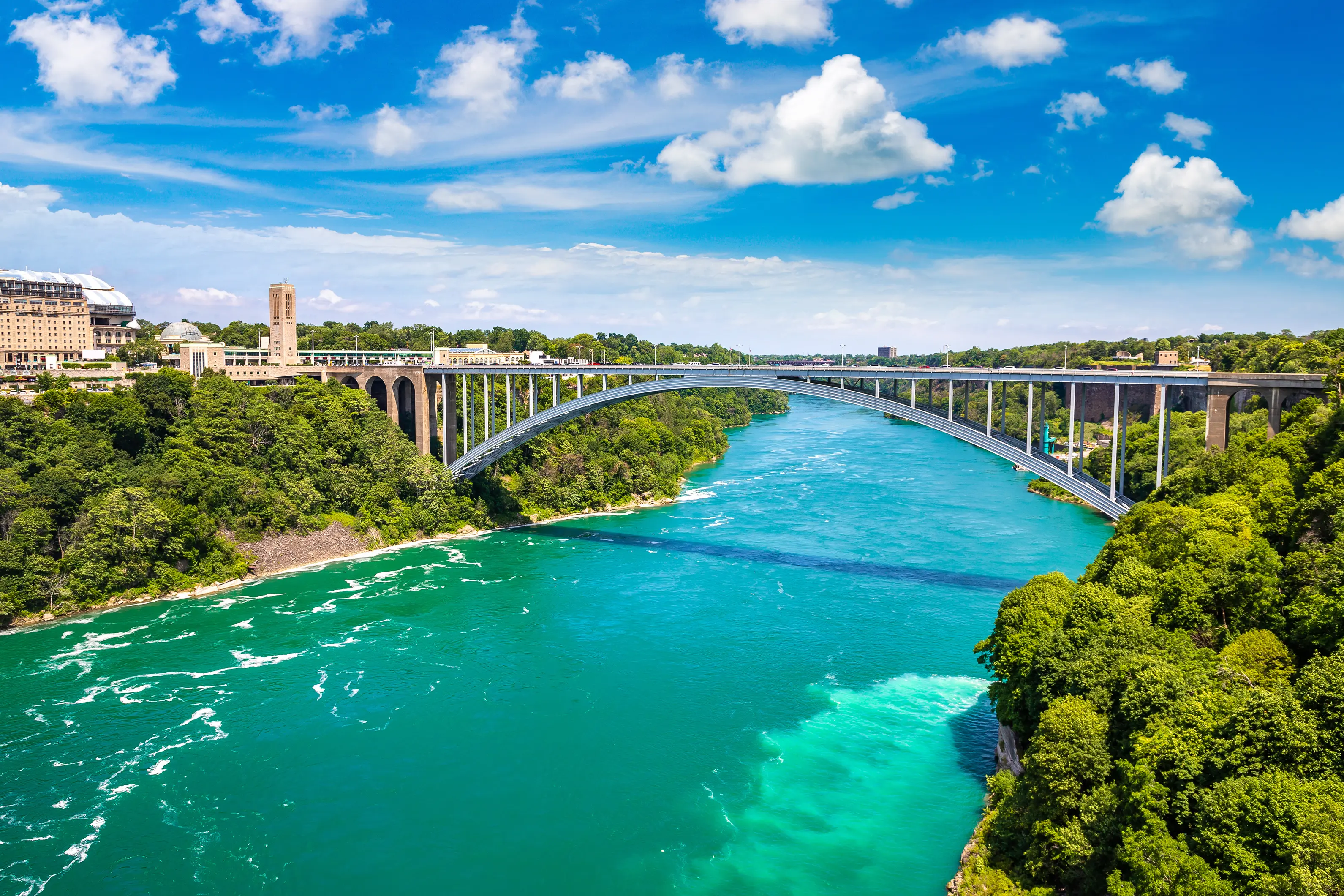 Rainbow international bridge above Niagara river between the United States of America and Canada in a sunny day