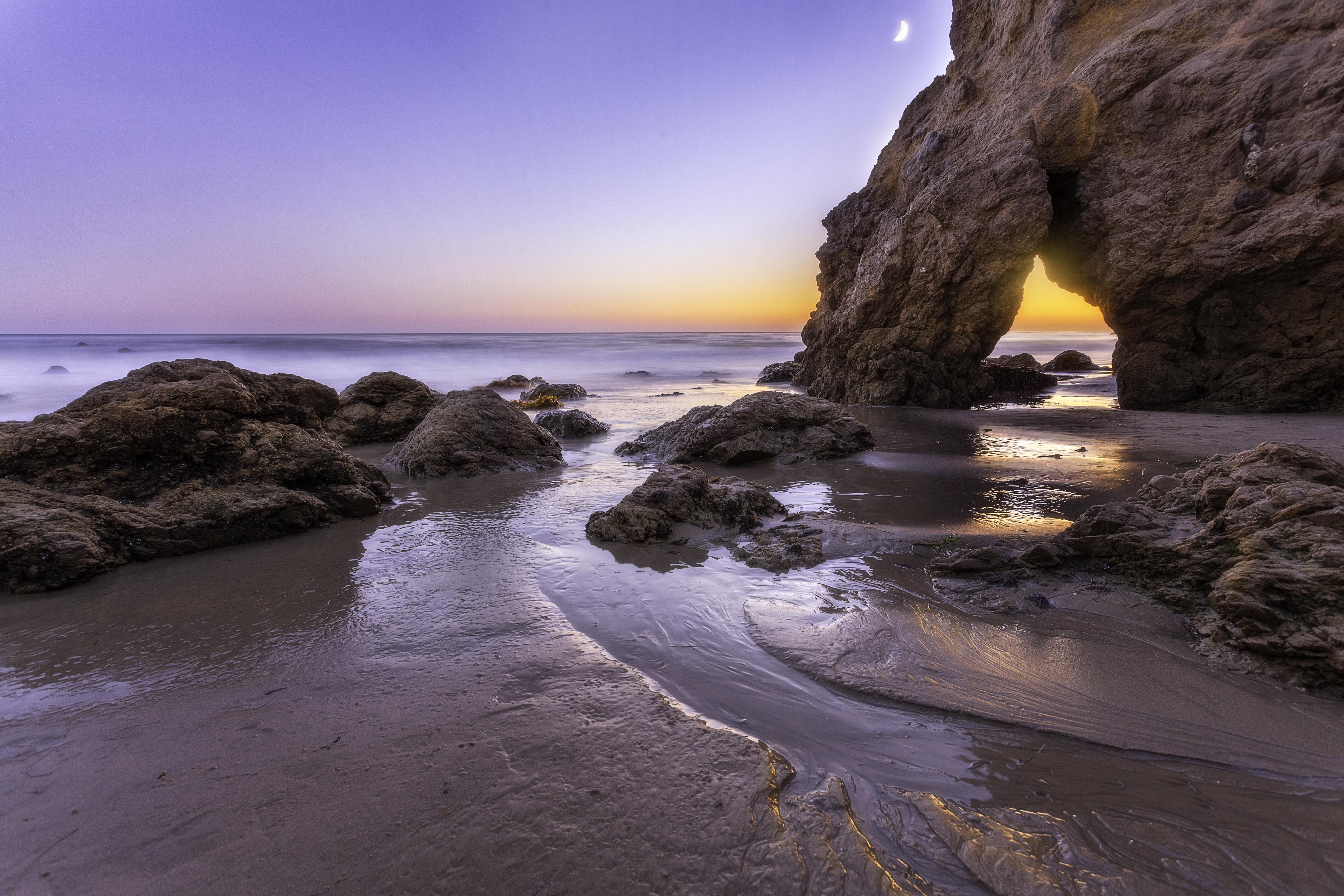 Outdoor image of the ocean/rocky scenery at Malibu beach.