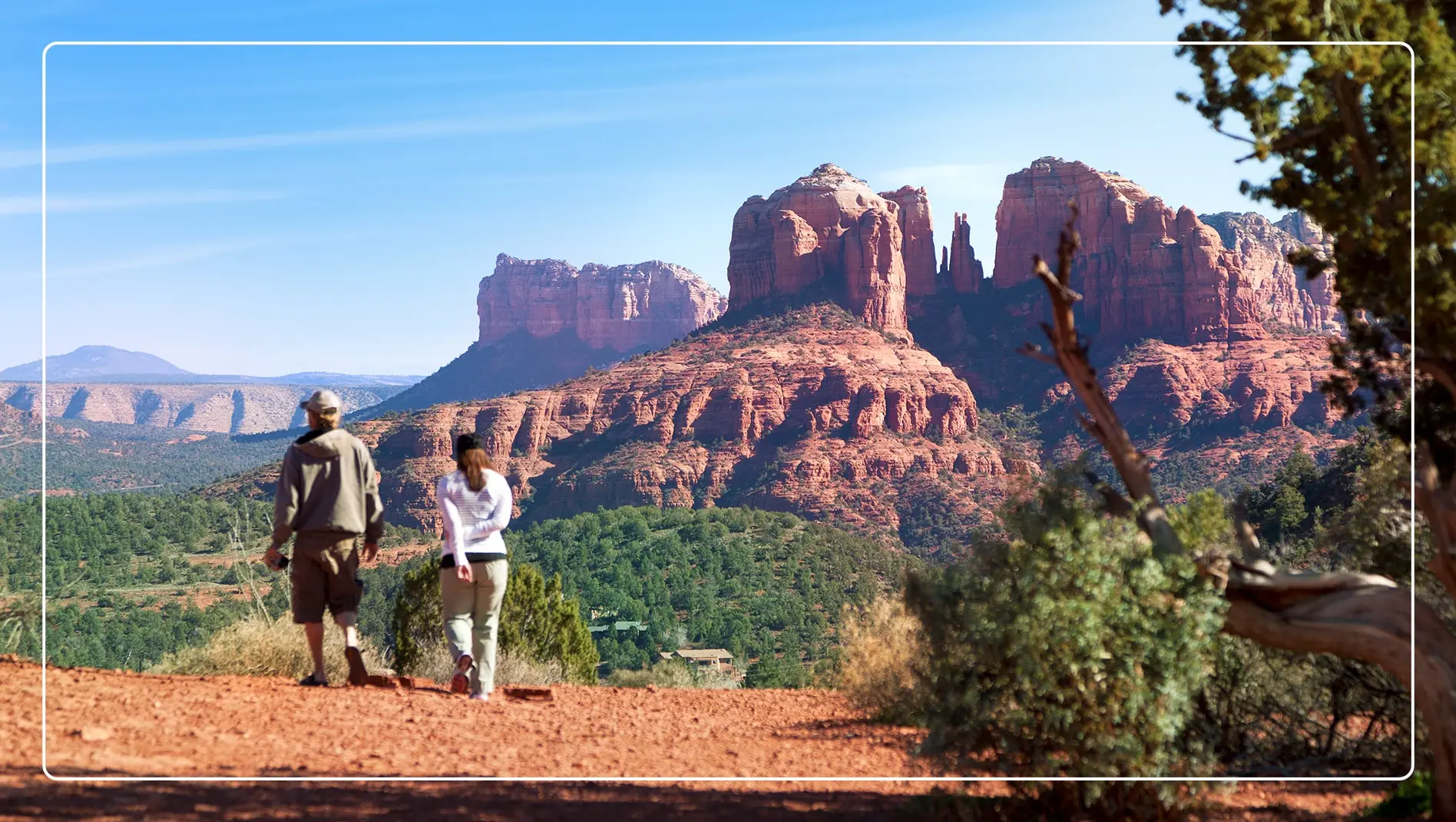 Two hikers enjoying the nature view in Sedona, Arizona.
