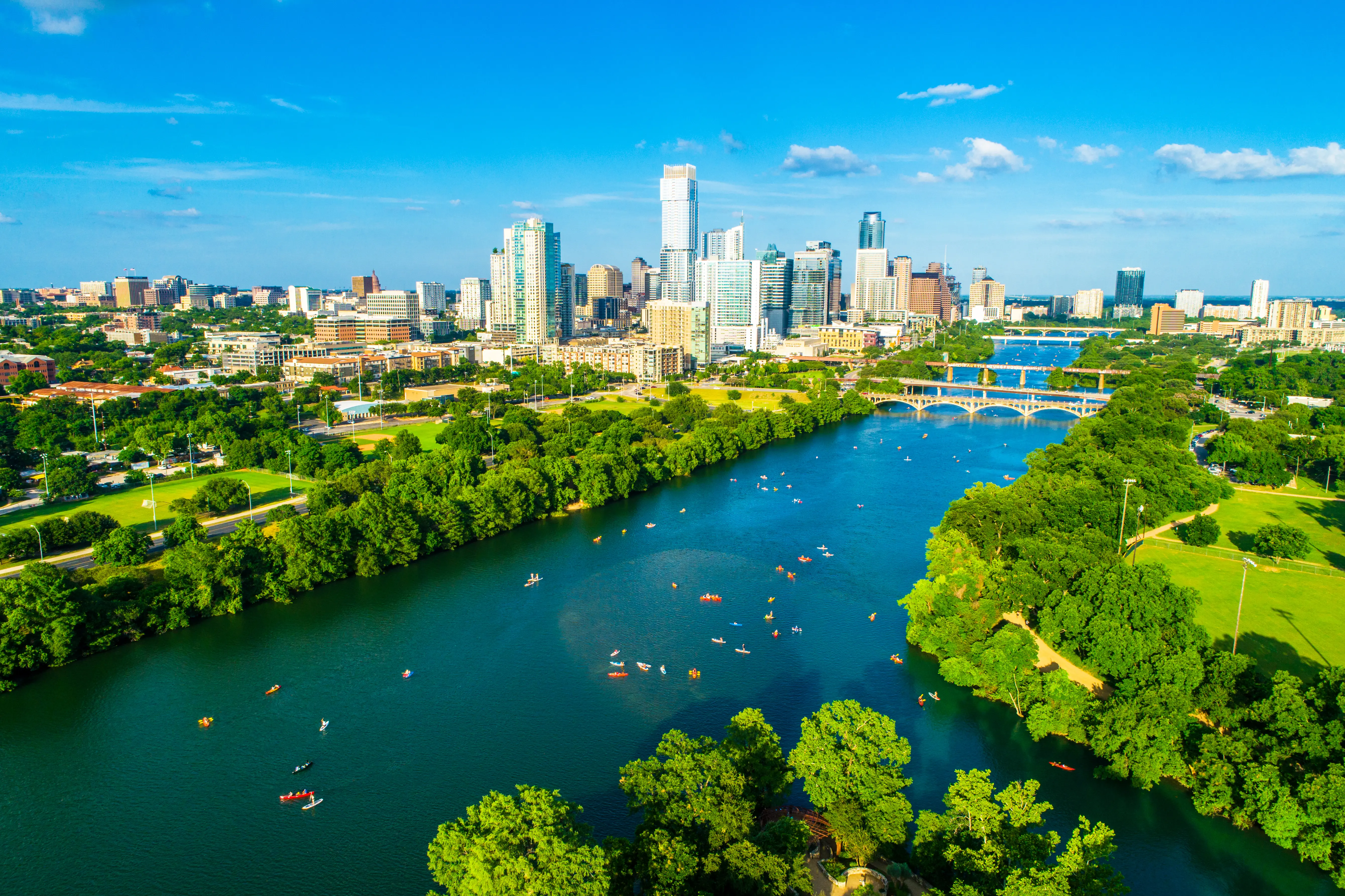Kayakers and paddle boarders on Lady Bird Lake