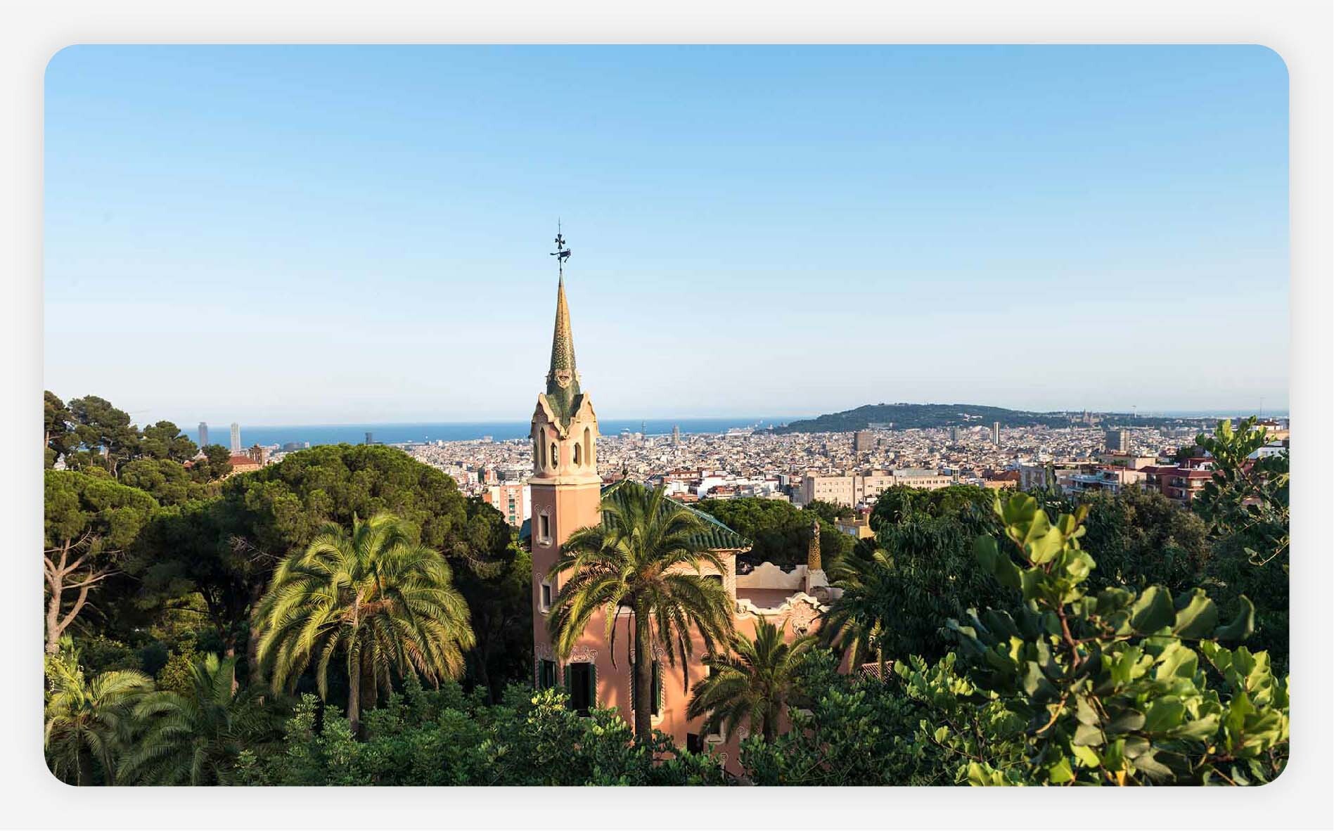 Aerial view of Barcelona city through Park Guell in summer