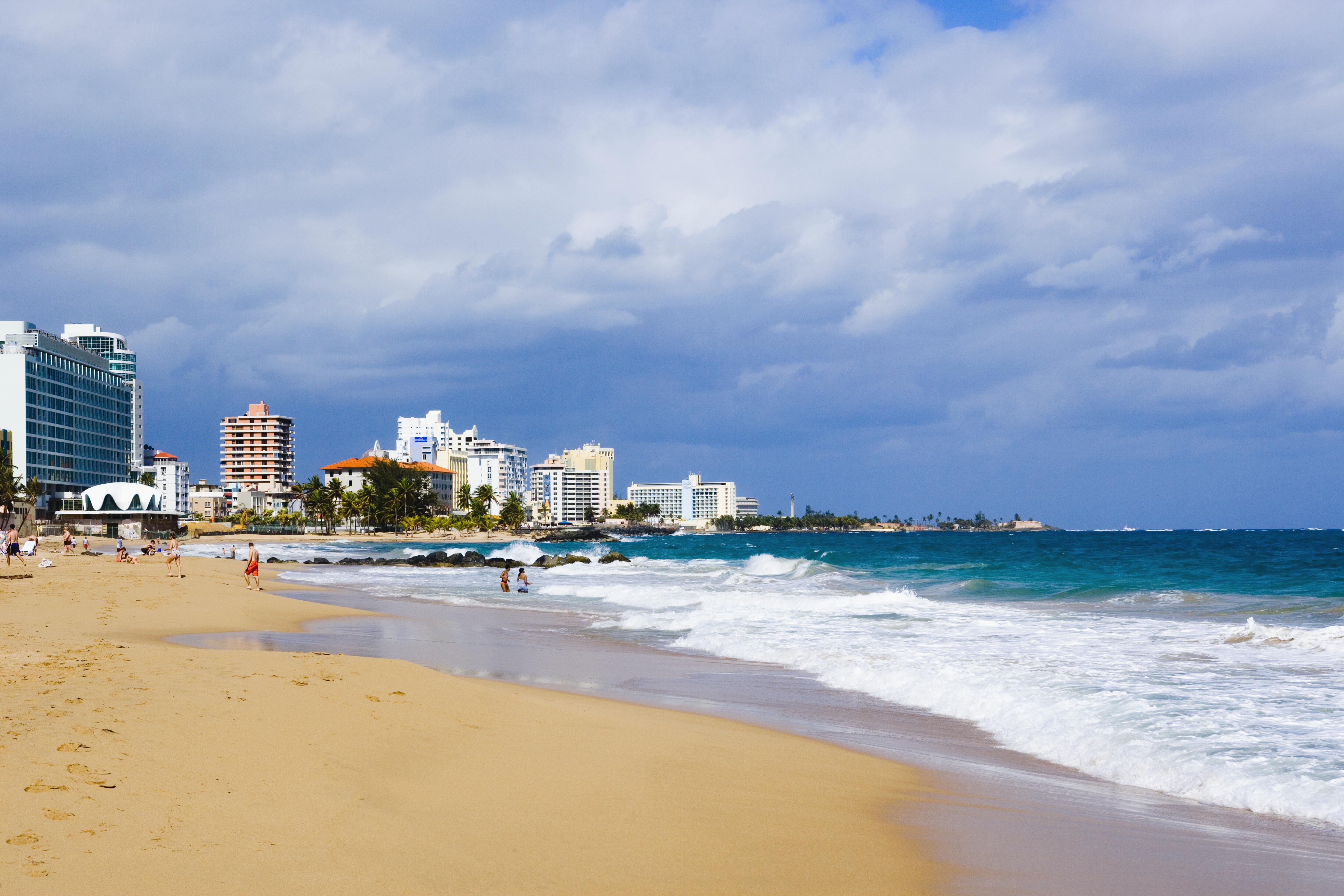 Image of hotels lining the ocean shore on Condado Beach