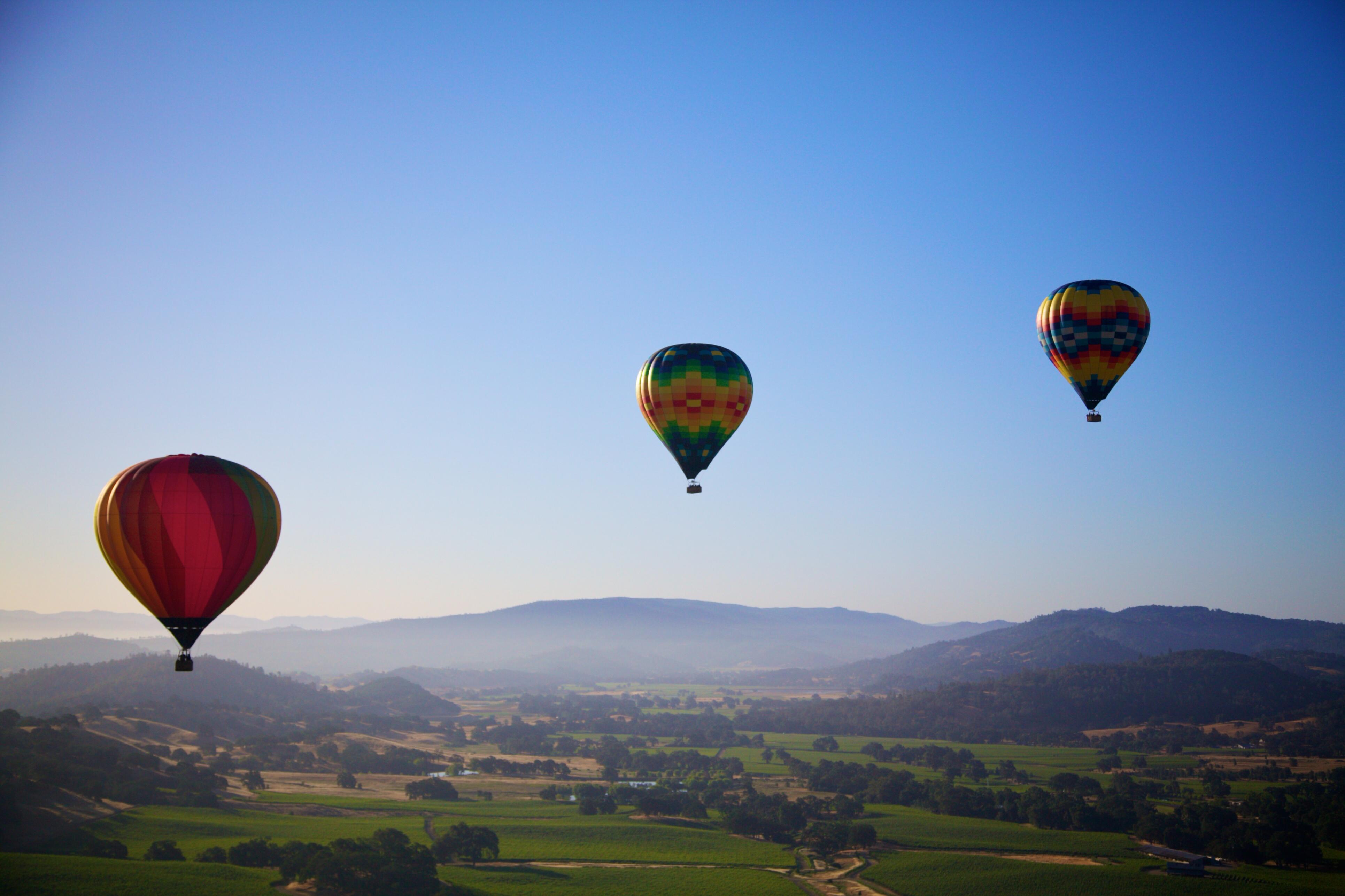 Image of hot air balloons flying over Napa Valley.