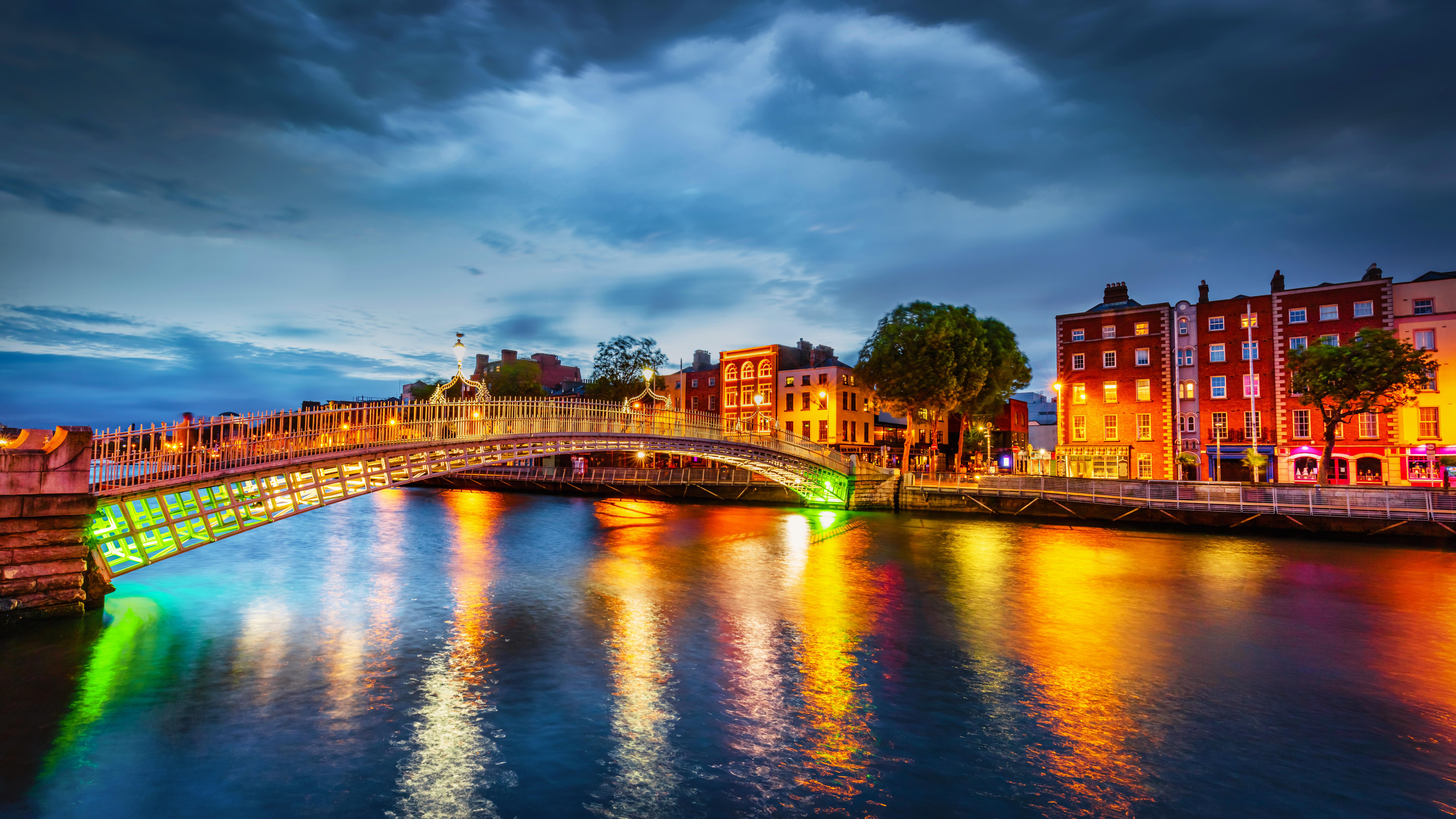Dublin’s Ha’penny Bridge illuminated by lights in the evening