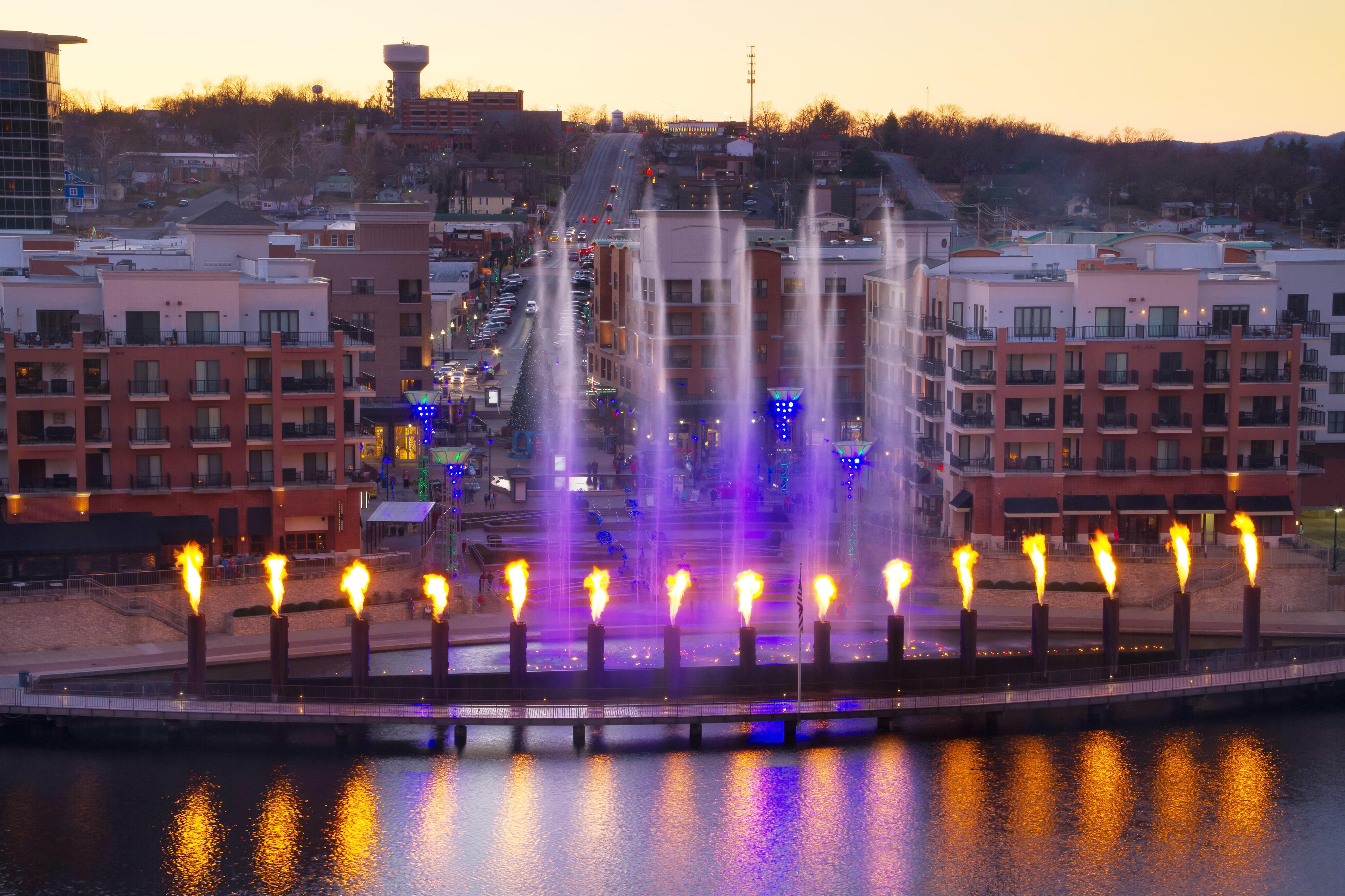 Skyline view of Branson with the evening fountain show lights at the landing waterfront park area, Missouri