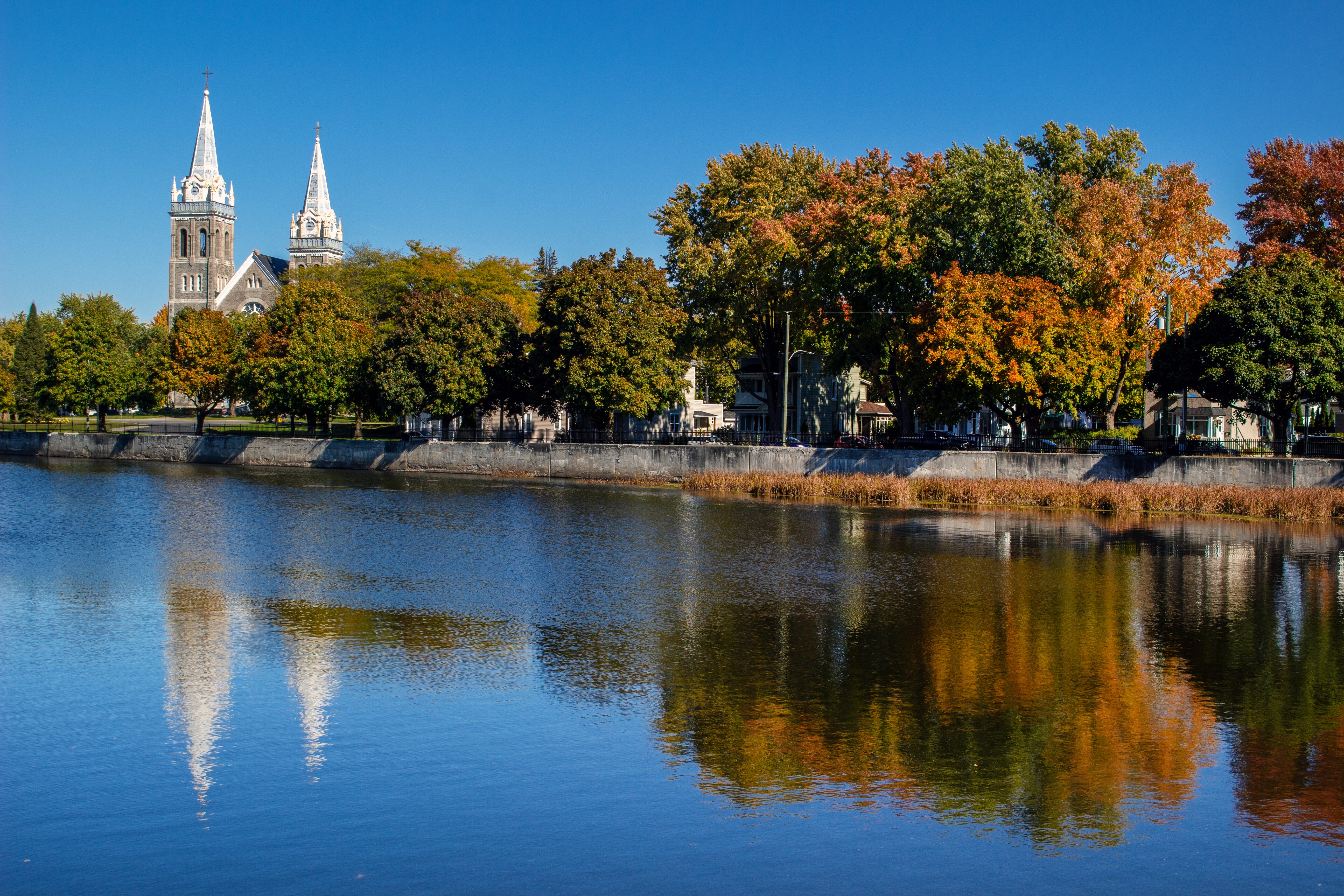 Image of the Yamaska River and Satin Romuald Catholic Church, in the Eastern Townships of Quebec, Canada.